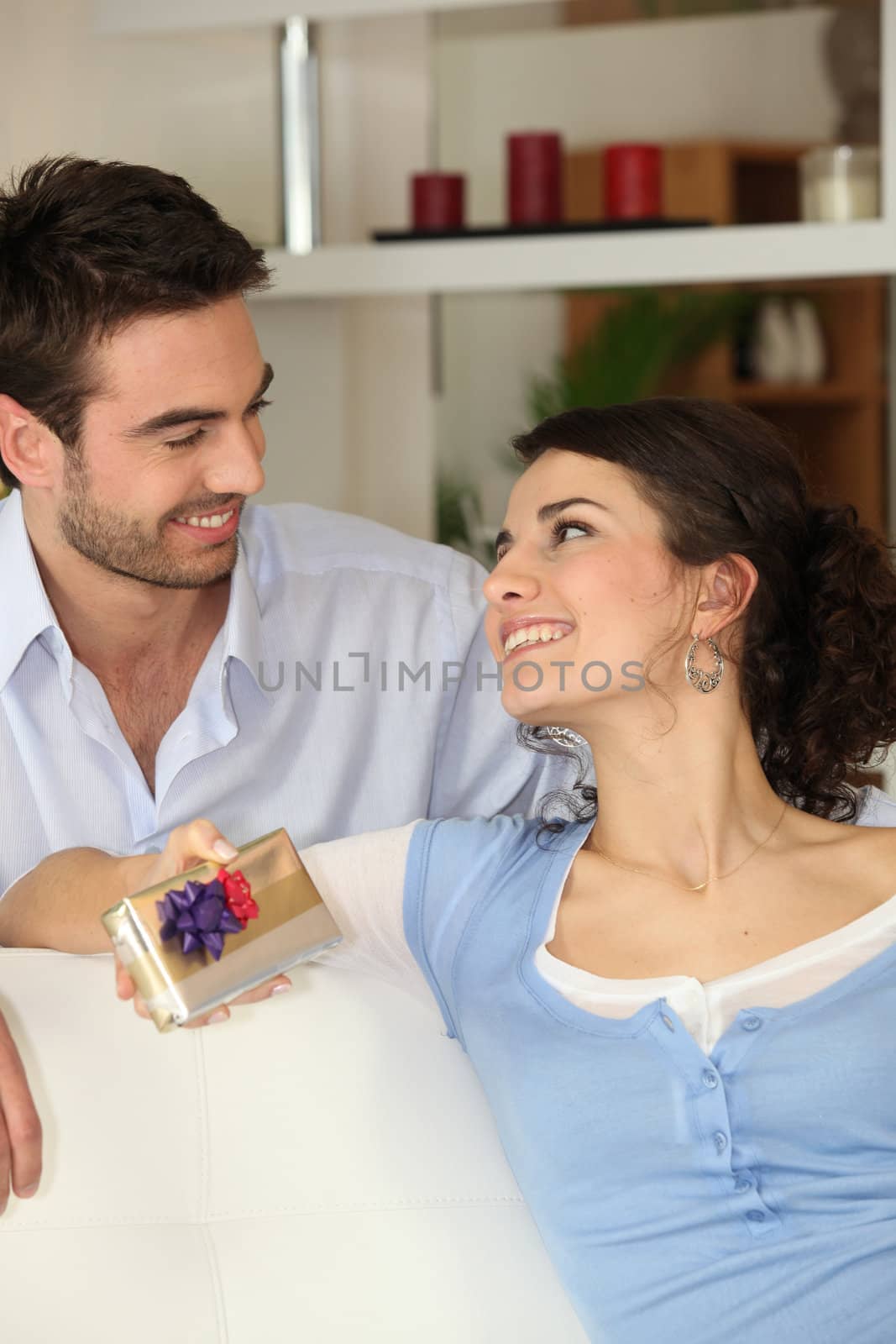 Man giving his girlfriend present