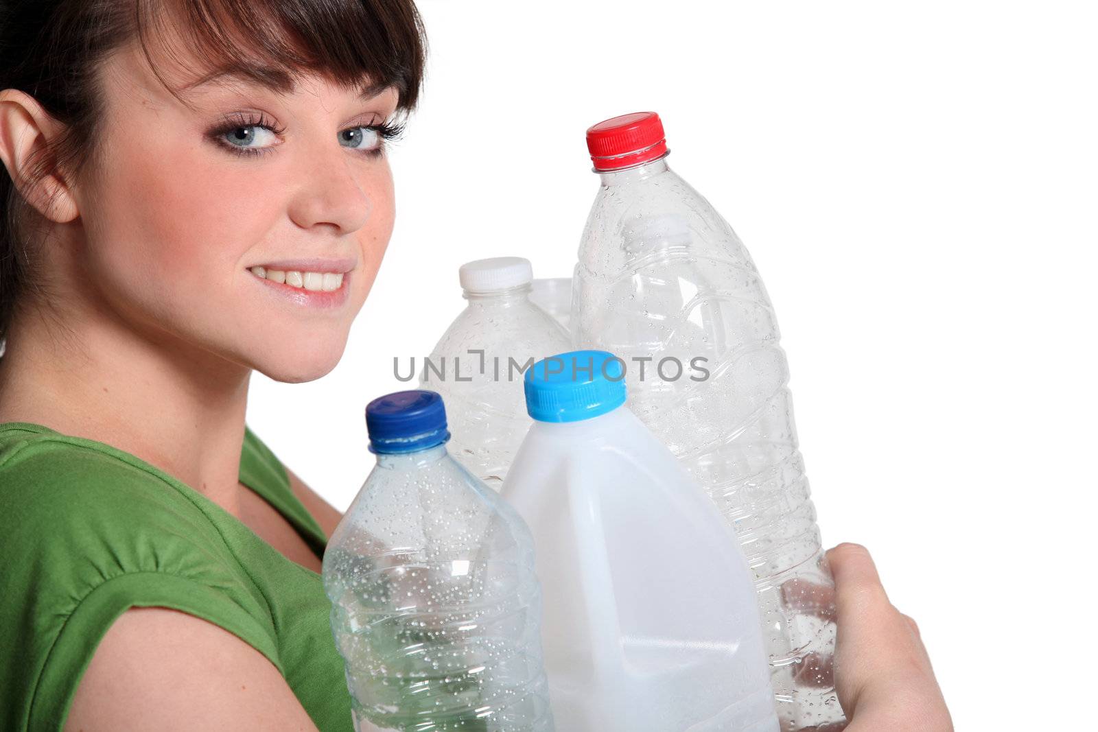 Young woman recycling plastic