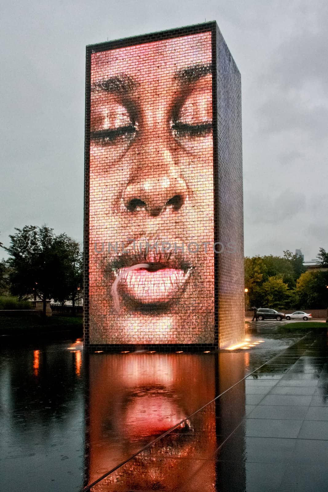 An image of a person projected on a giant Chicago Crown Fountain structure