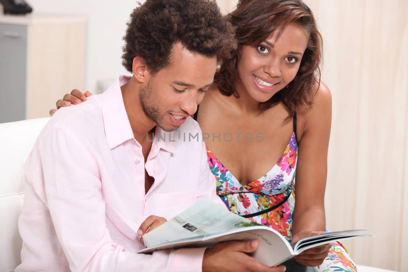 Couple reading on a sofa