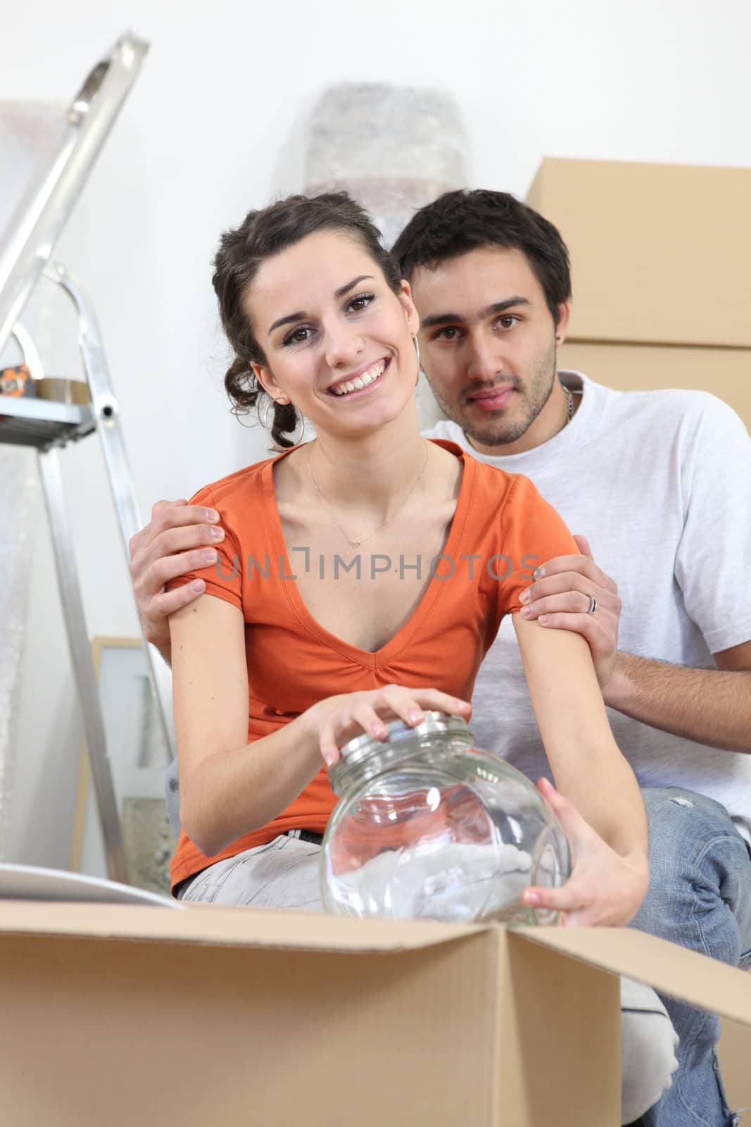 Couple unpacking glassware