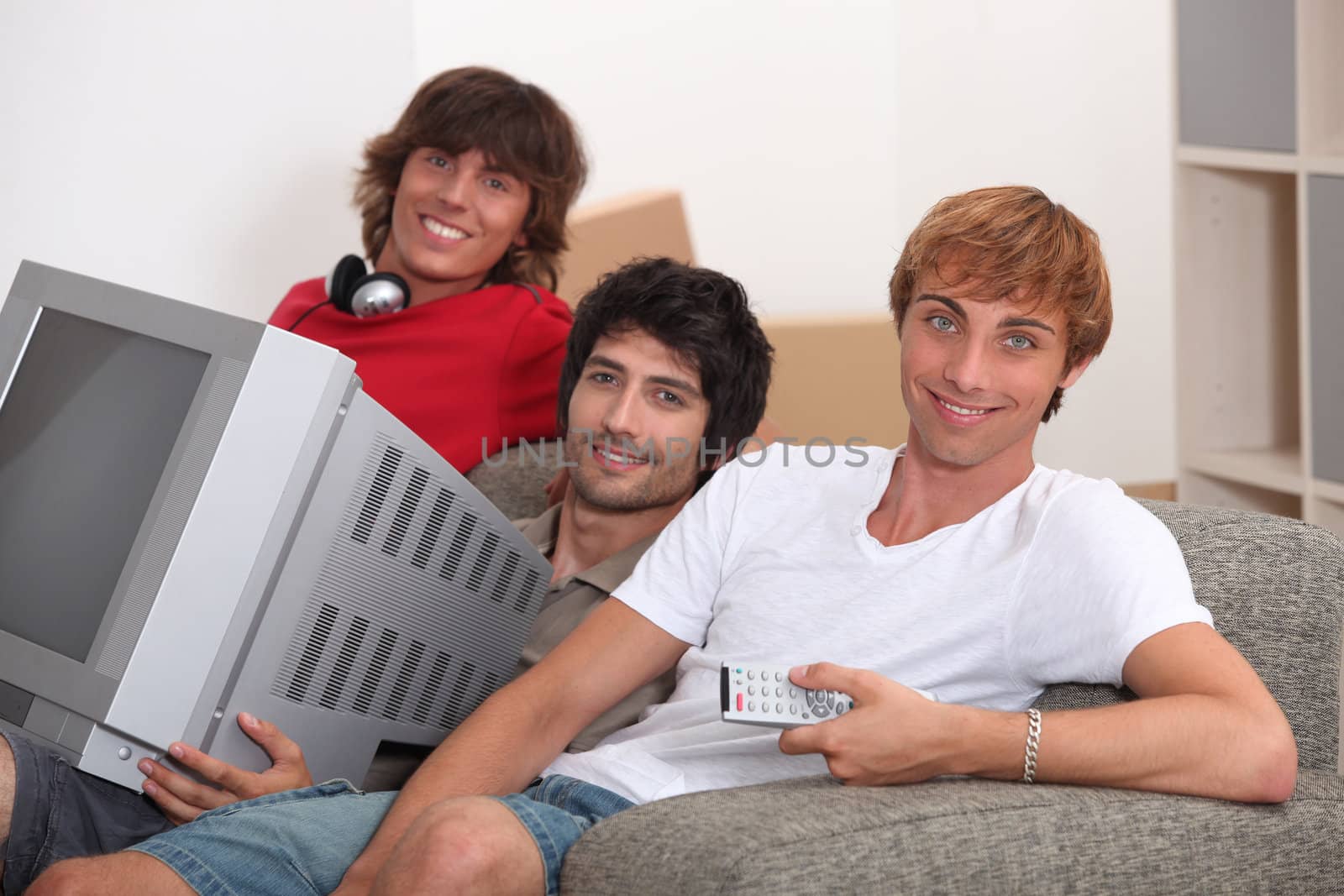 Three young men moving into to new house