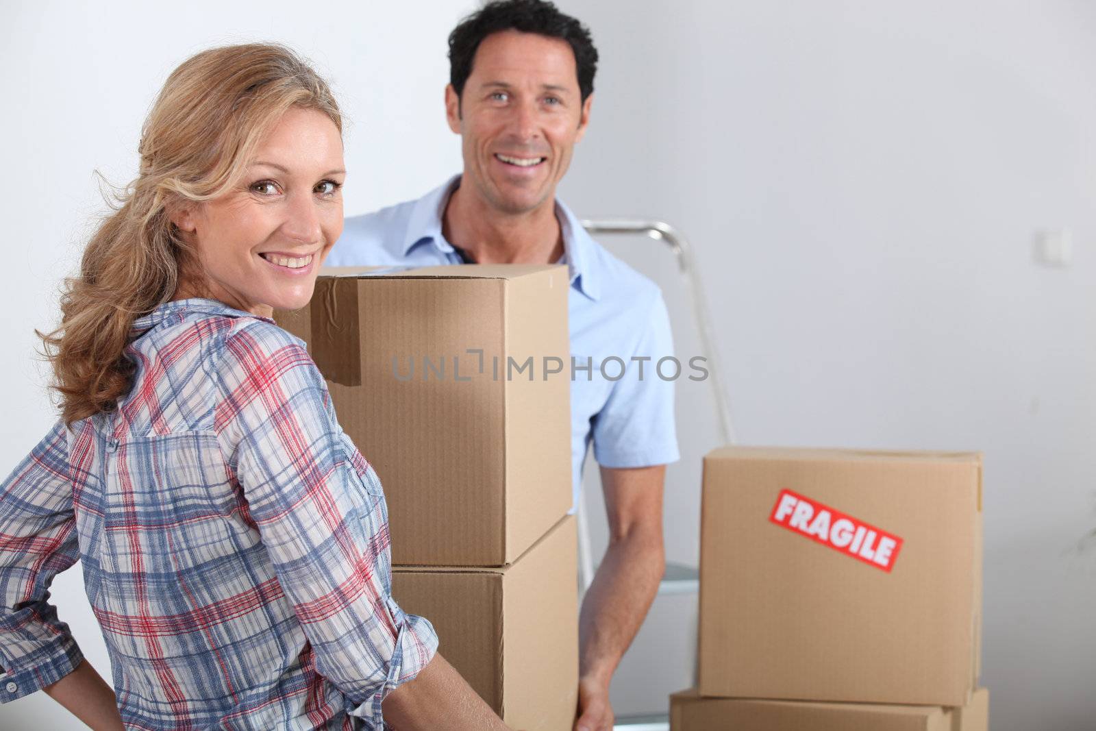 Couple moving boxes