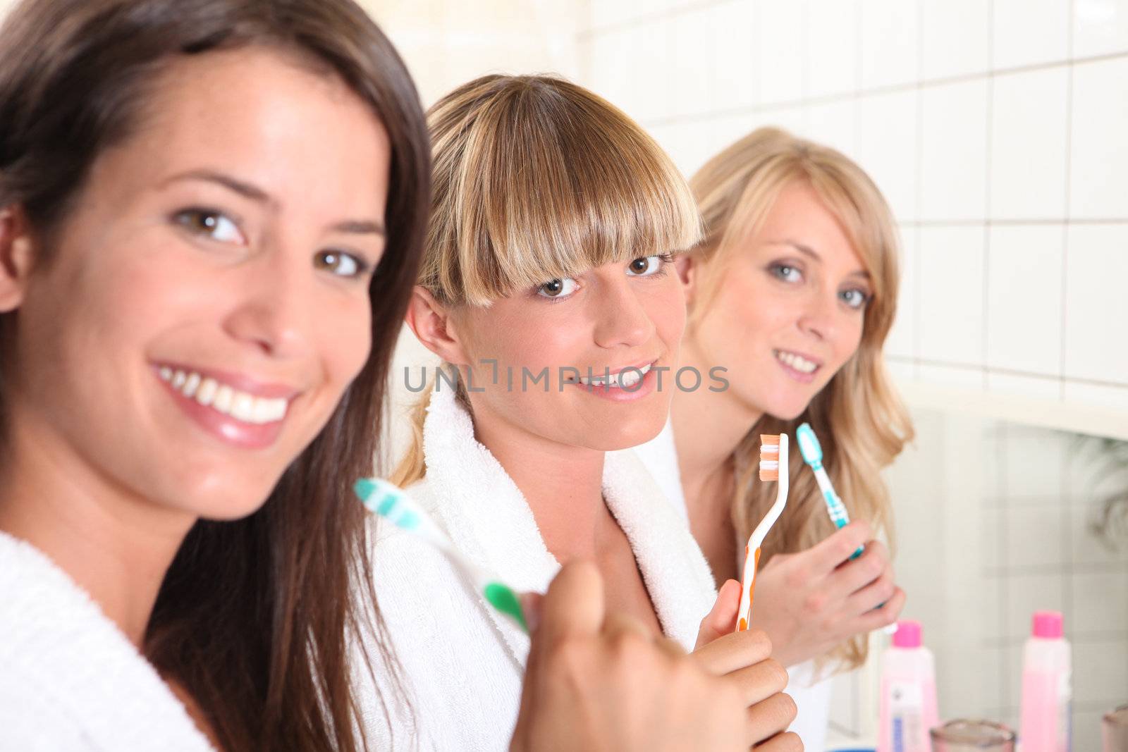 Young woman in the bathroom together by phovoir