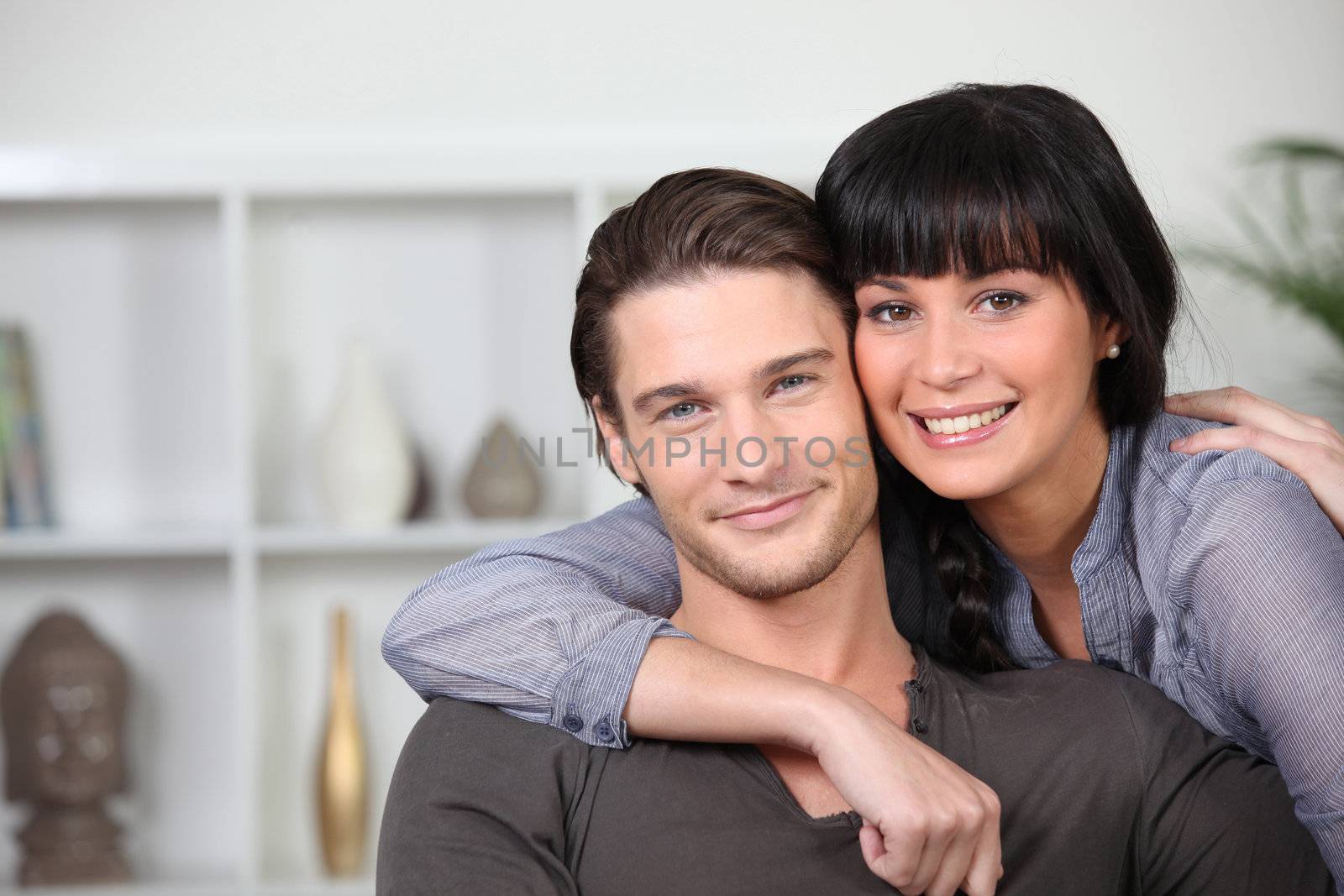 Young couple at ease together at home