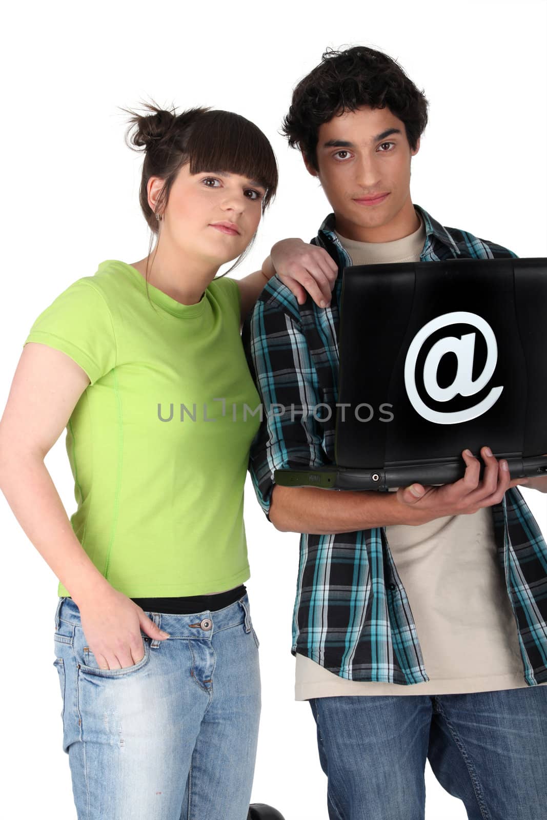 Teenage couple with a laptop