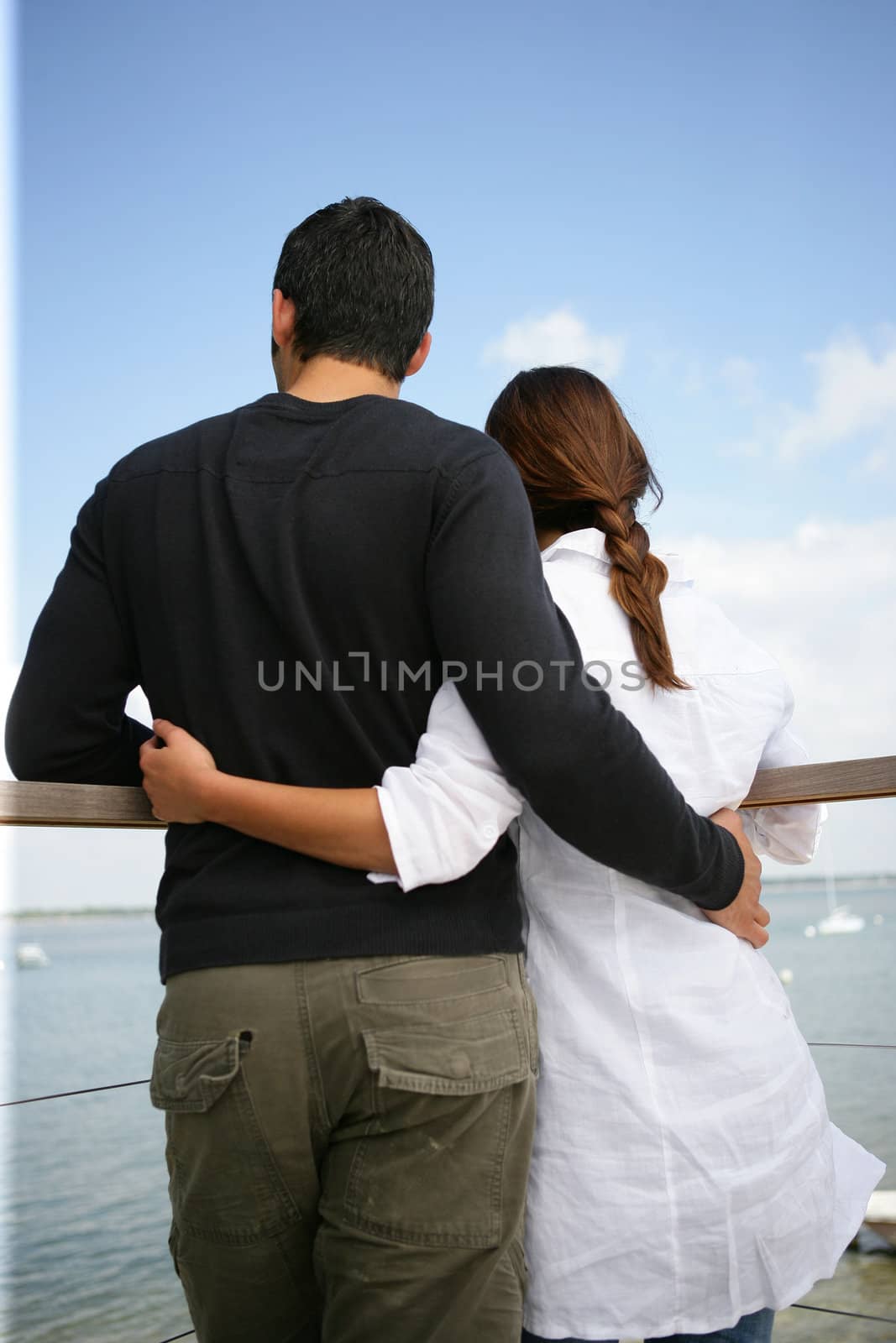 Couple stood on pier