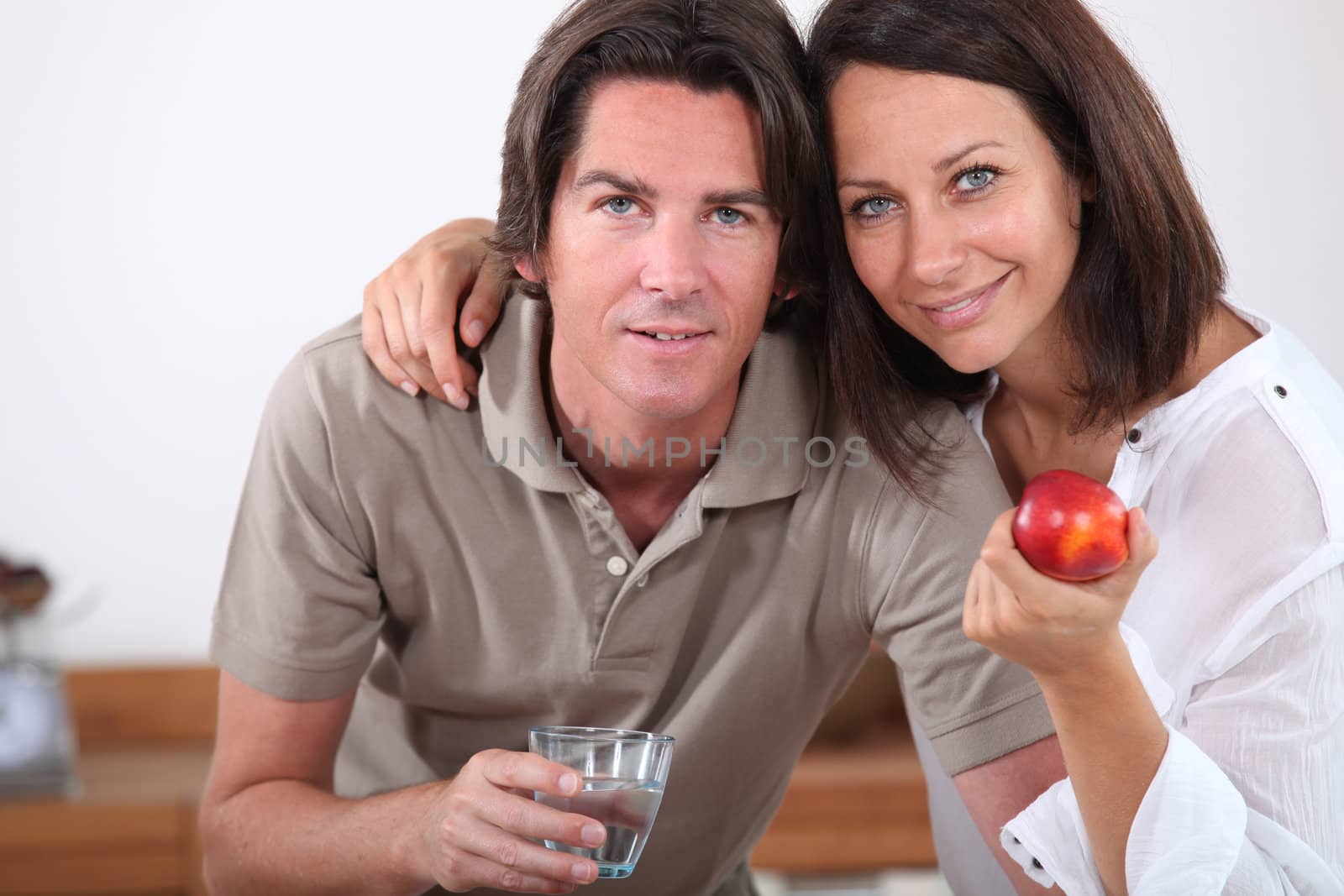 Couple with an apple and glass of water