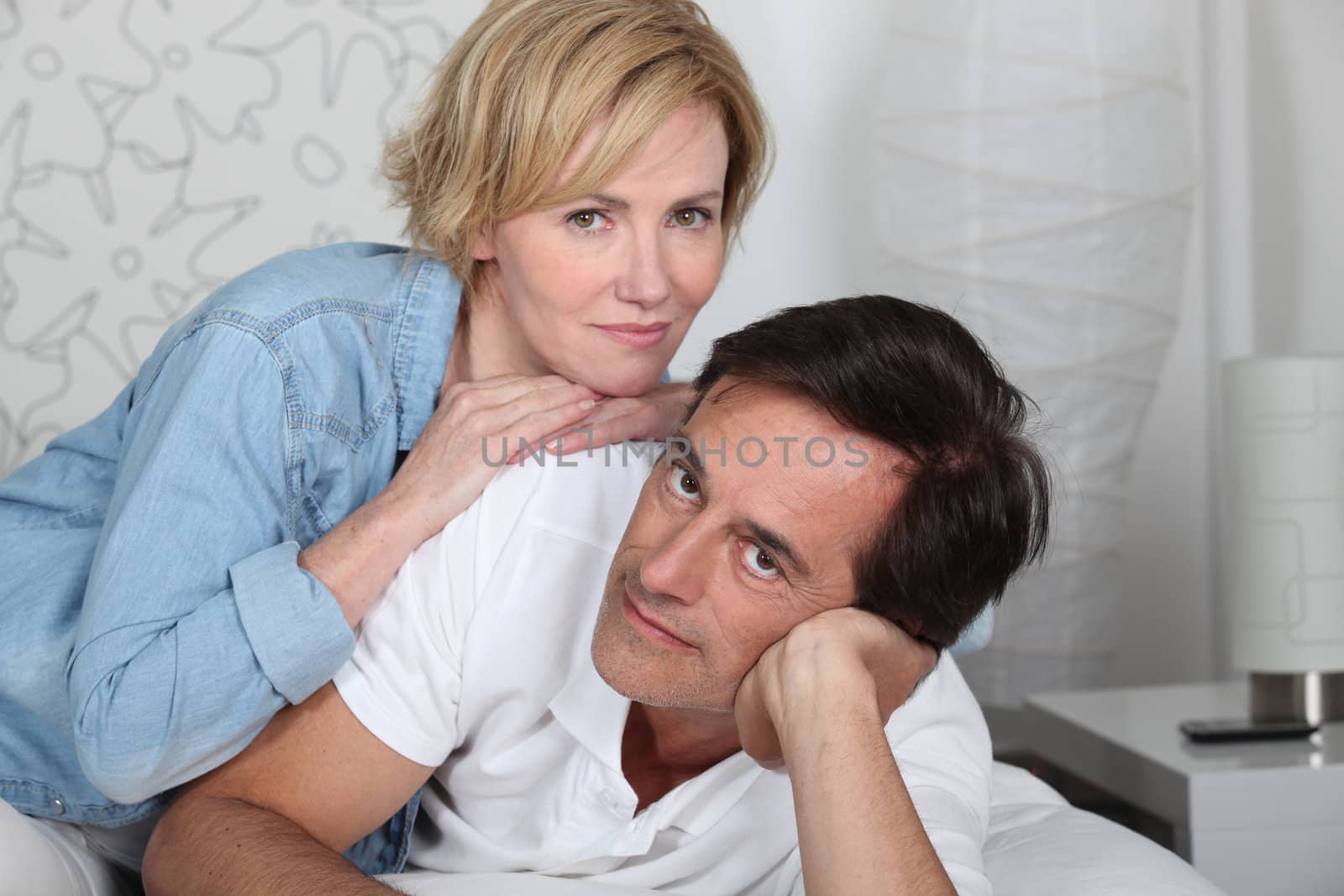 Couple lying on bed