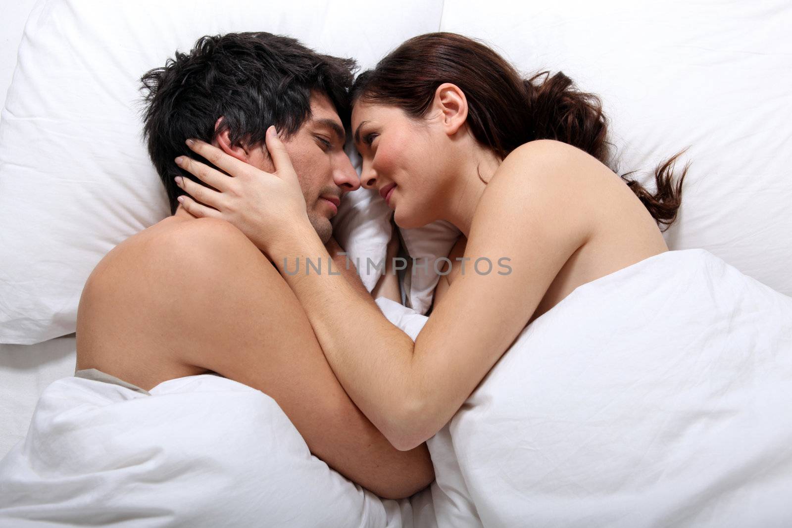Naked couple in bed