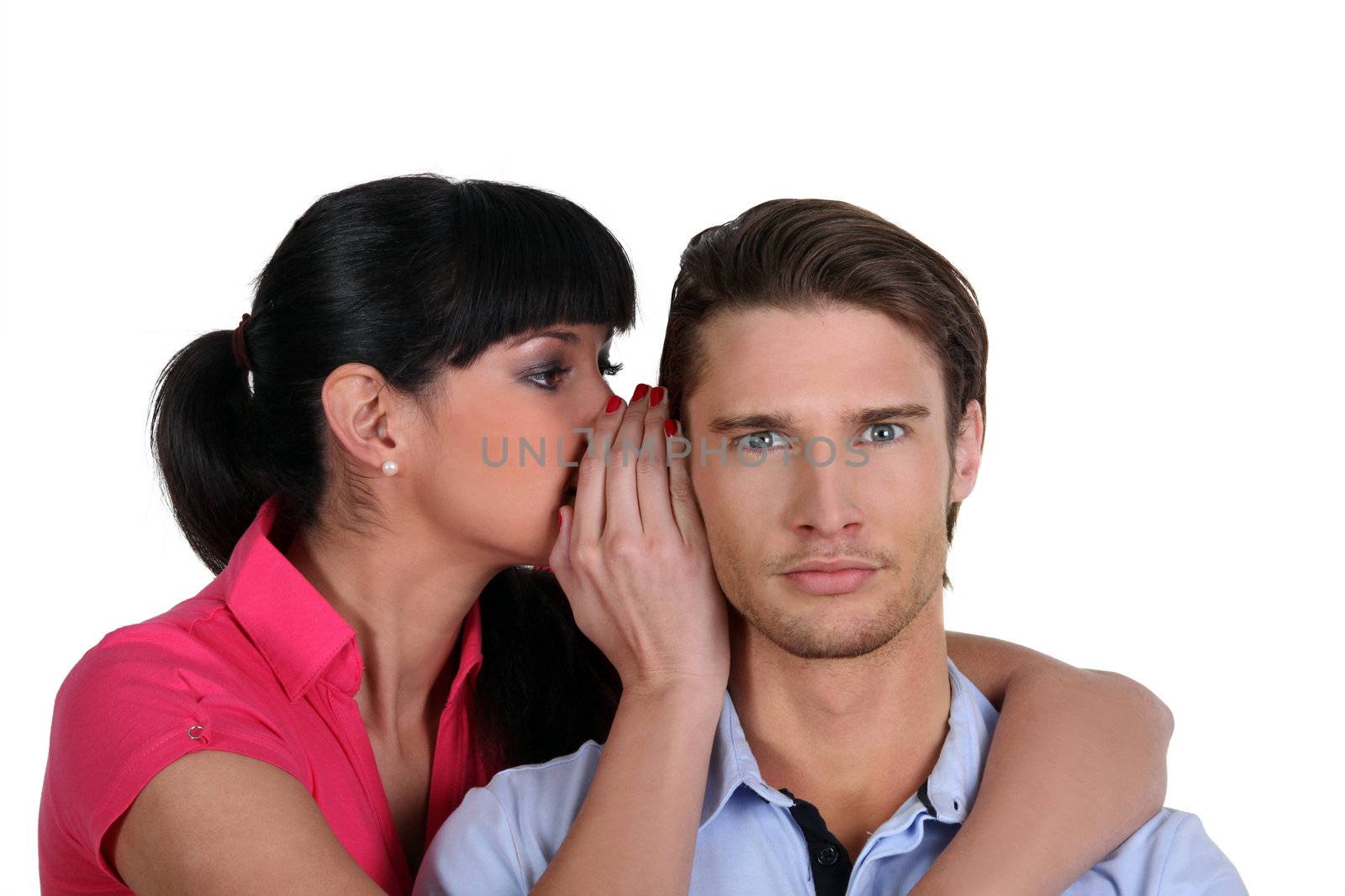 a woman whispering a secret to a man by phovoir