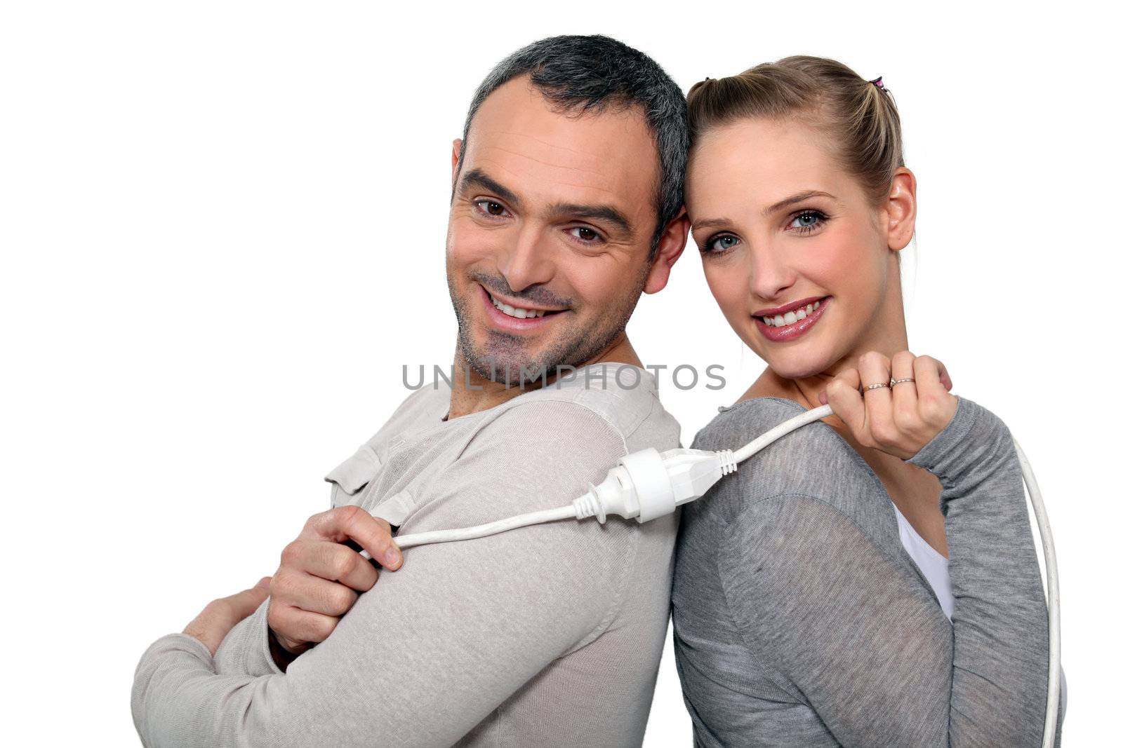 Couple holding electrical cable