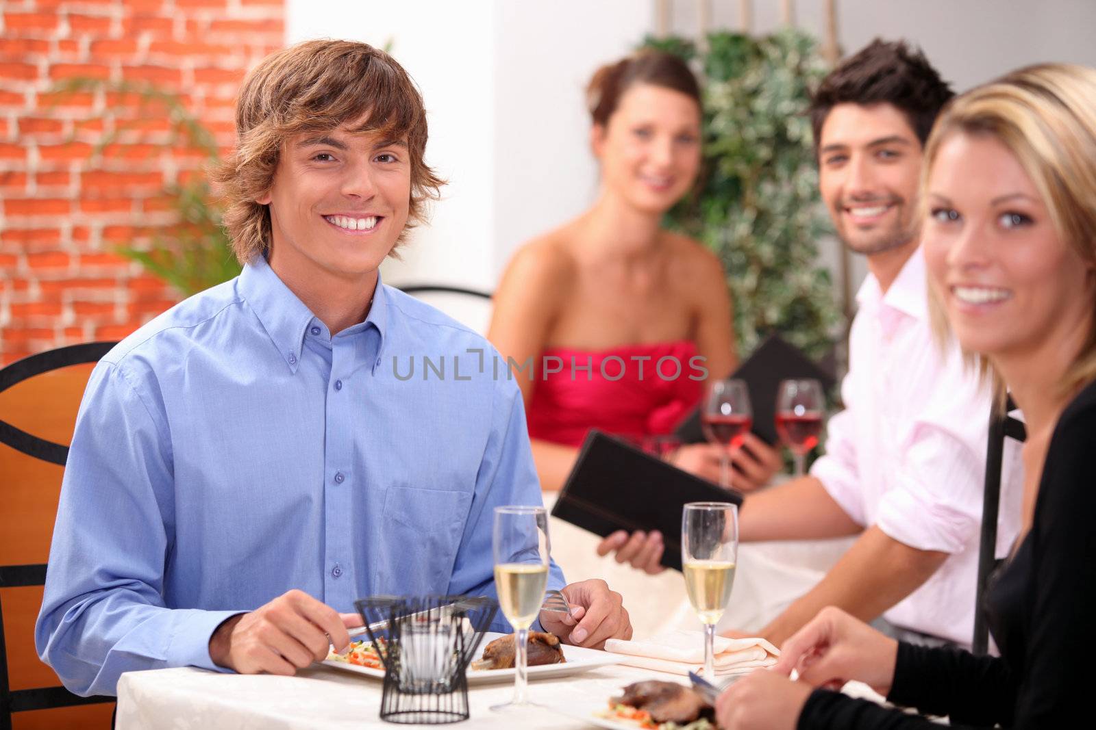 Young couple having a meal in a restaurant together