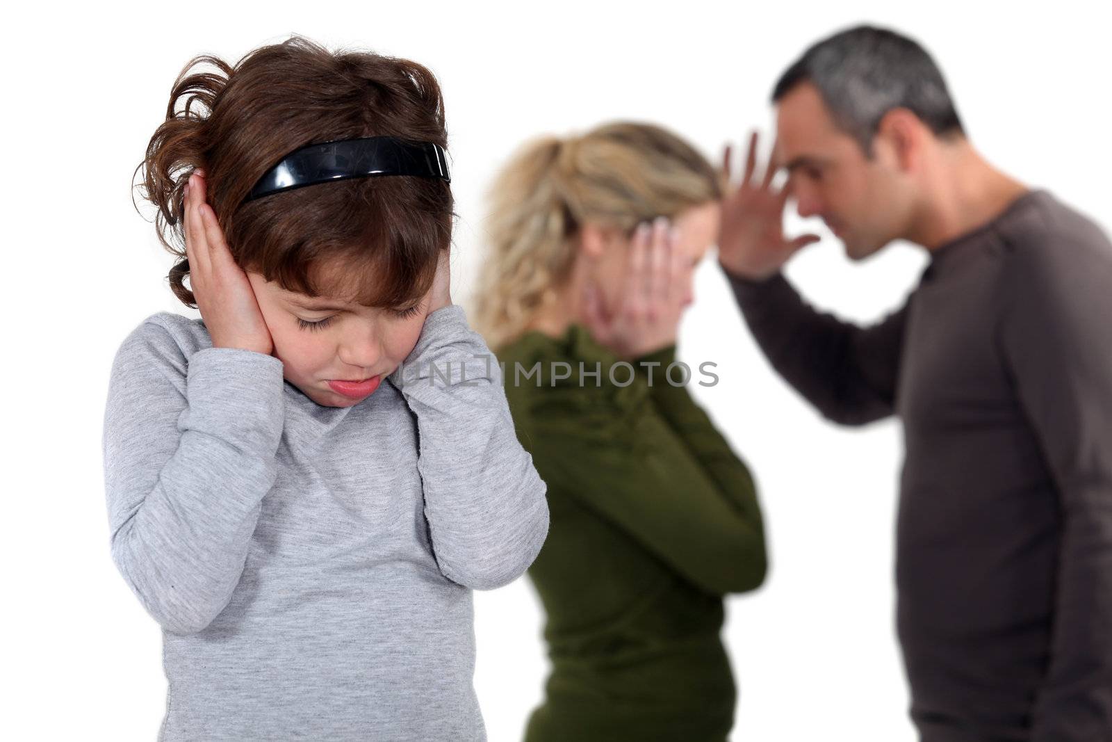 Daughter stood with arguing parents by phovoir