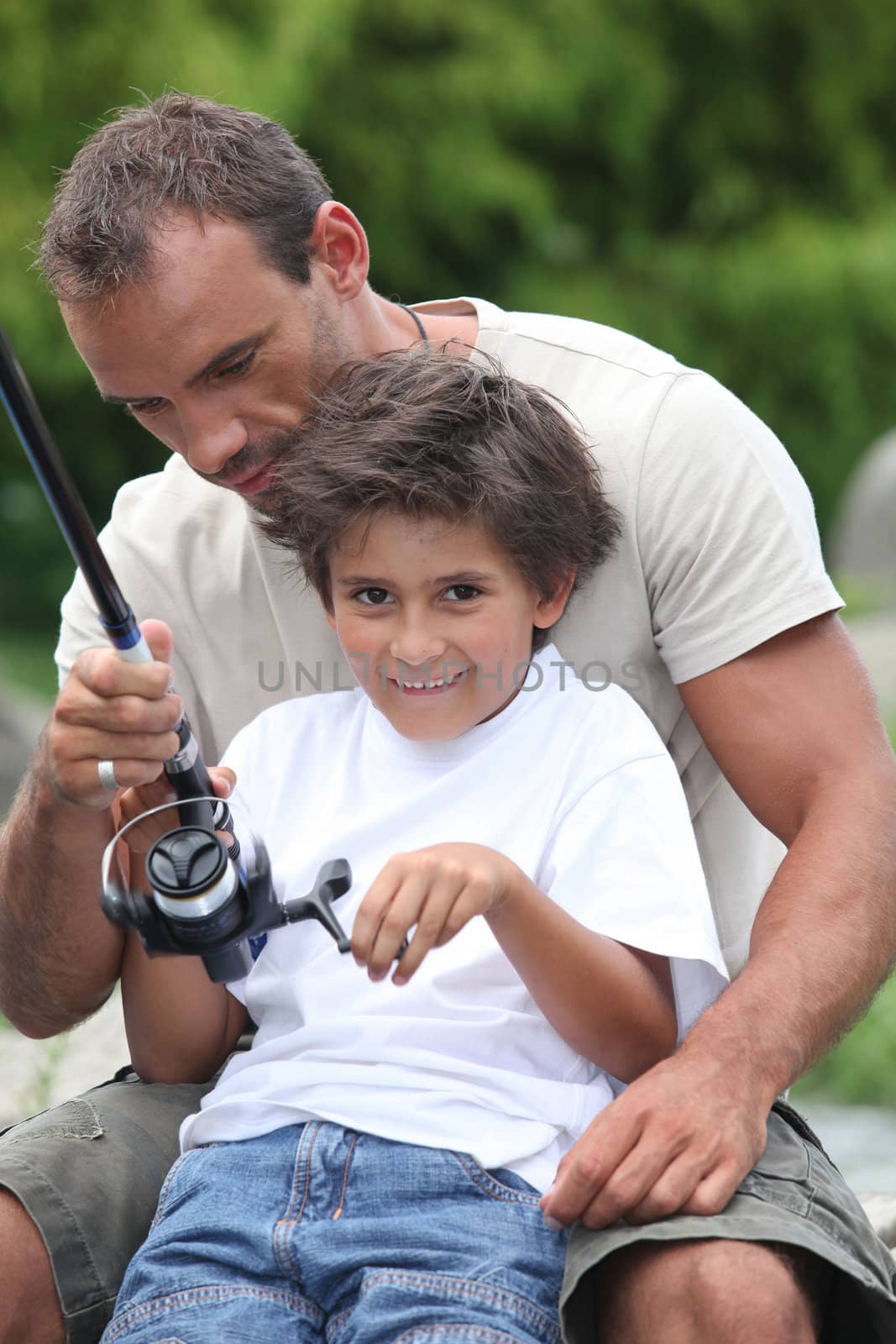 Father and son fishing together