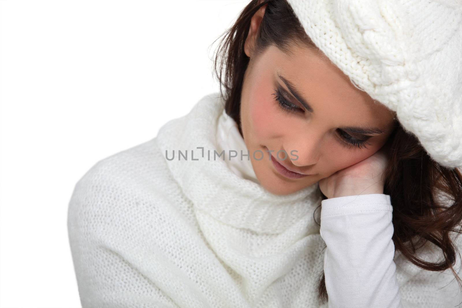 Shy woman wearing hat and jumper