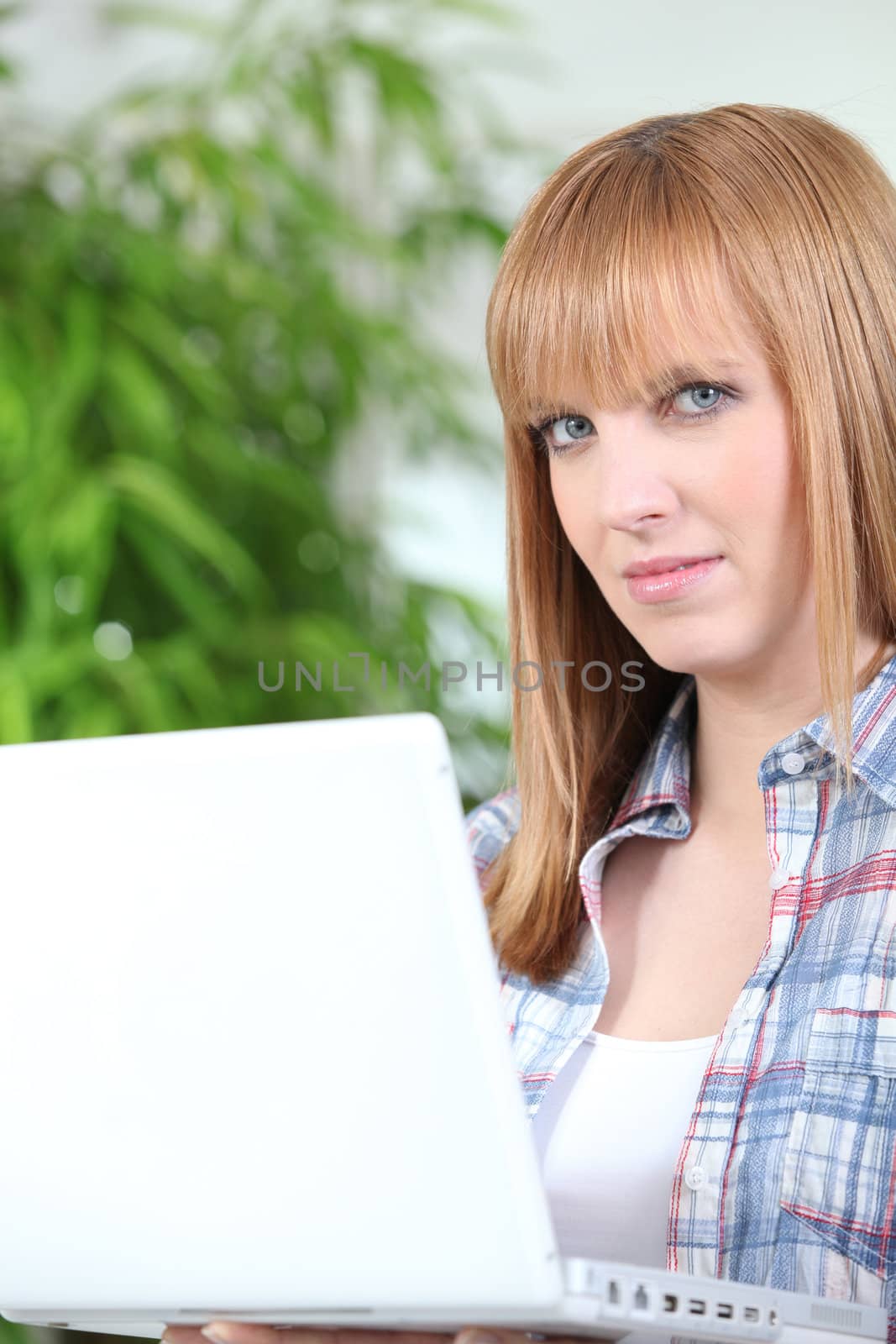 Red haired girl with laptop