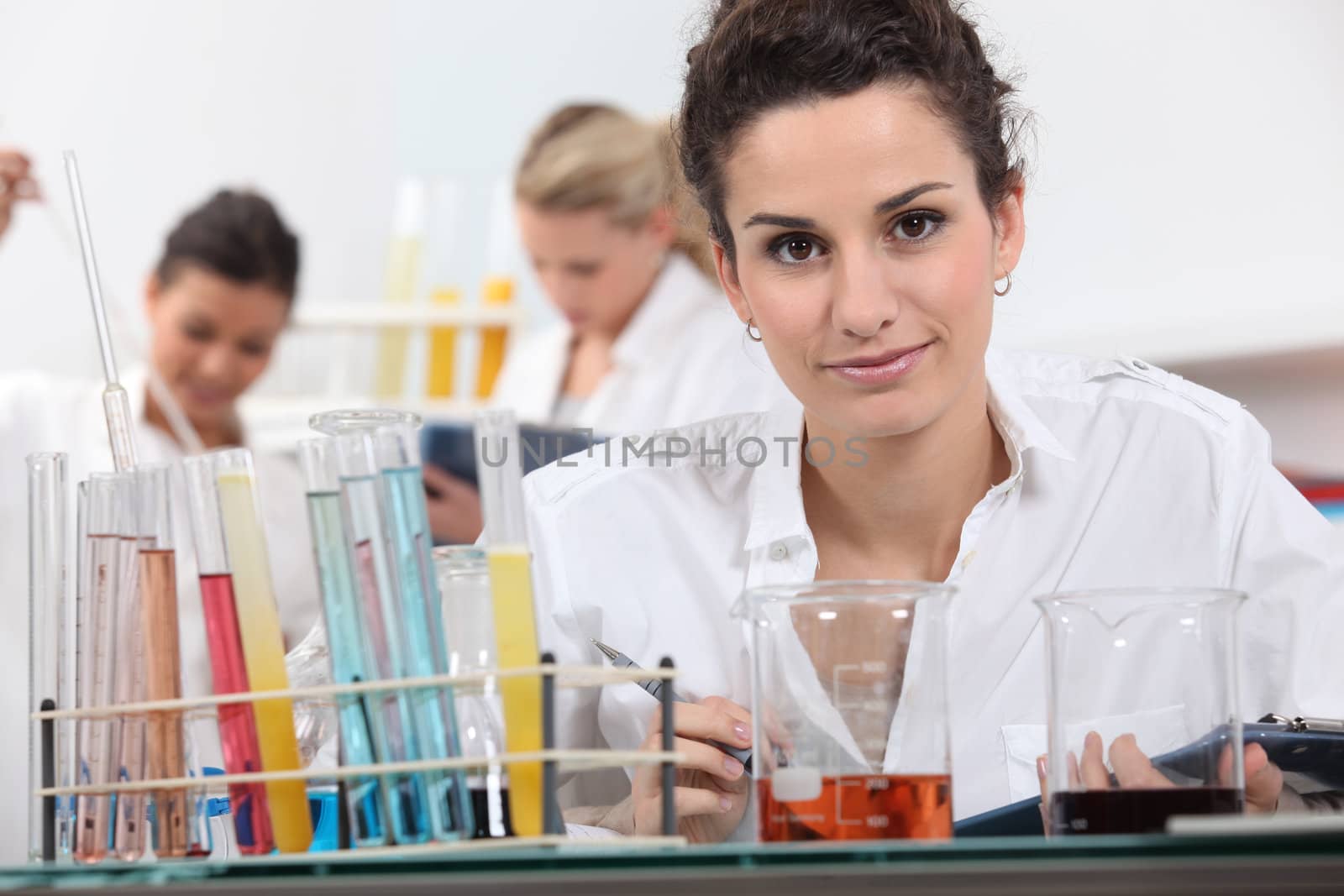 Women working in a laboratory by phovoir