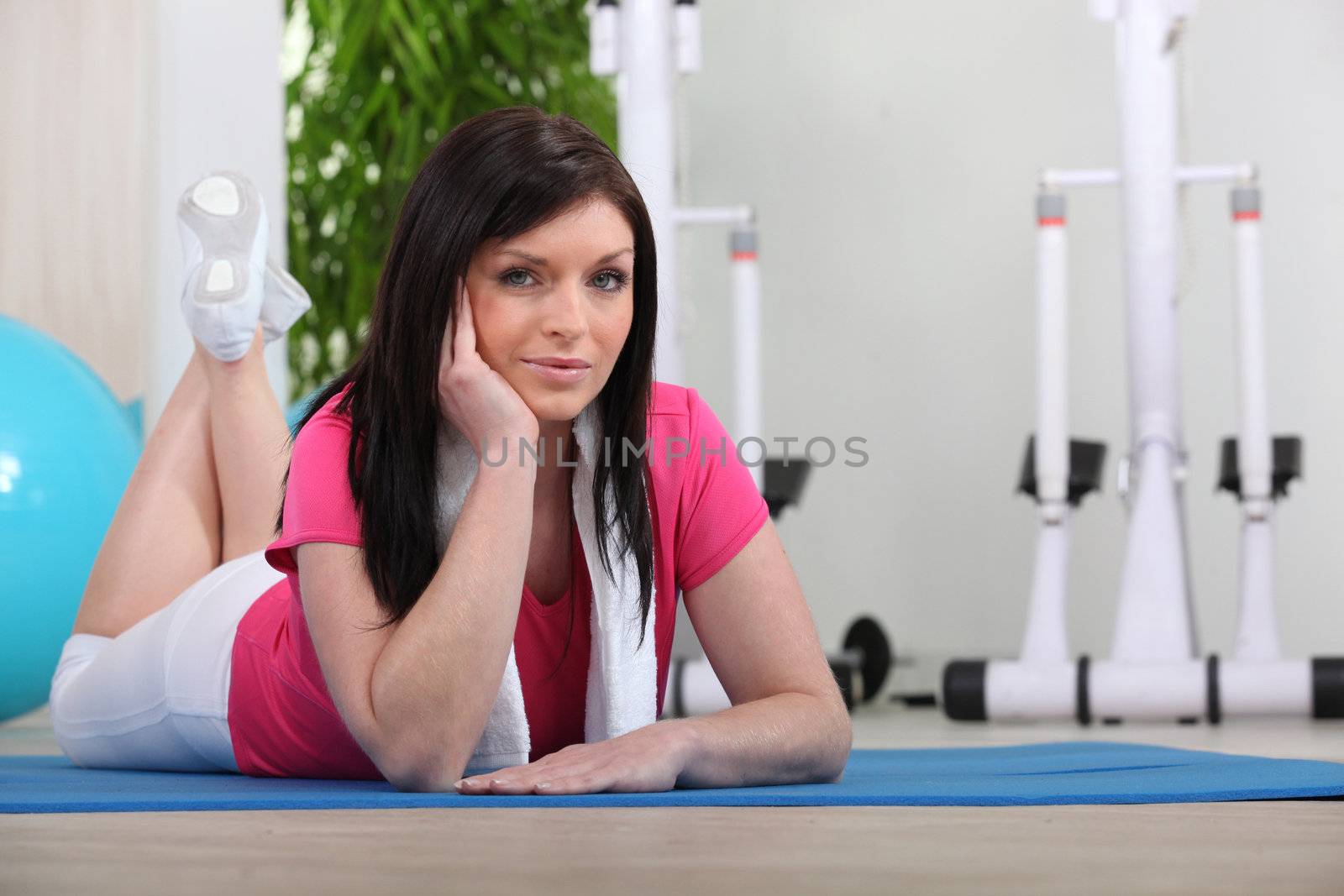 Woman laid on gym mat