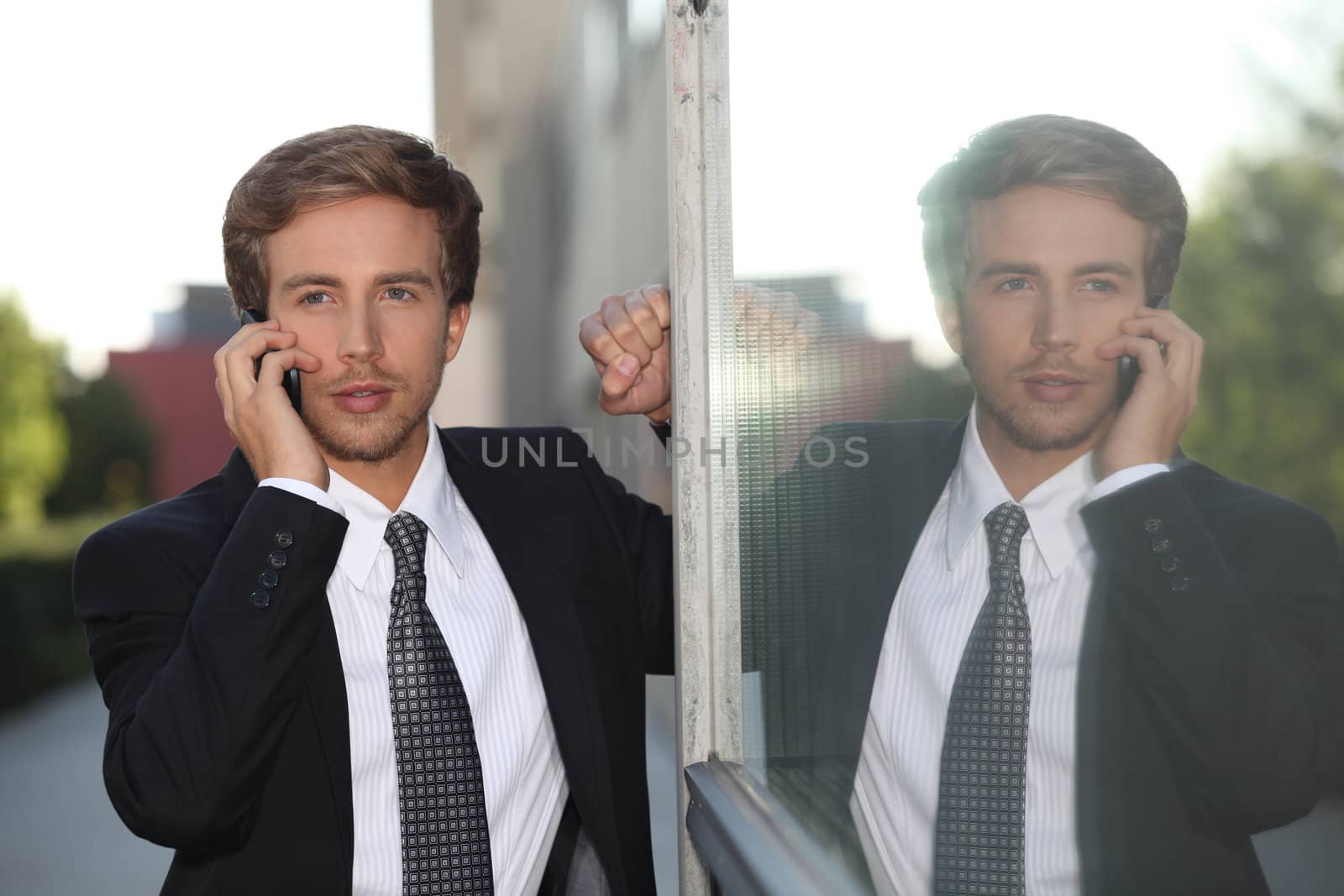 Young businessman on mobile phone