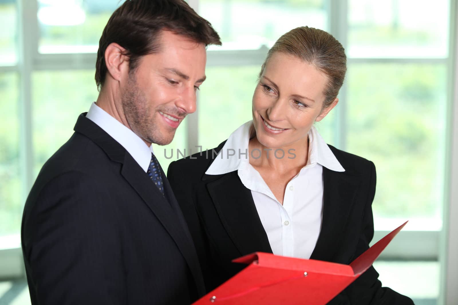 Businesscouple looking at paperwork