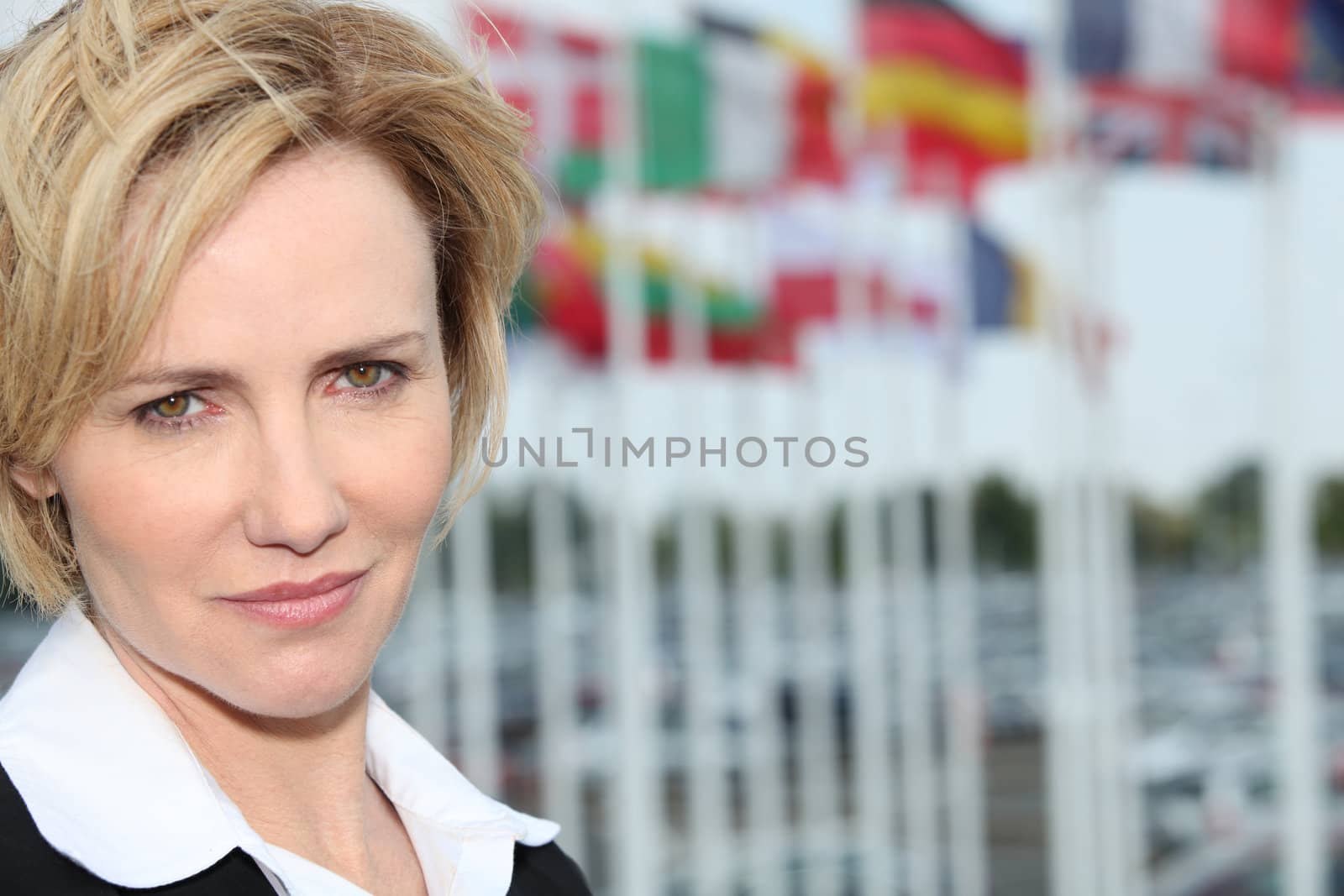 Woman next to flags