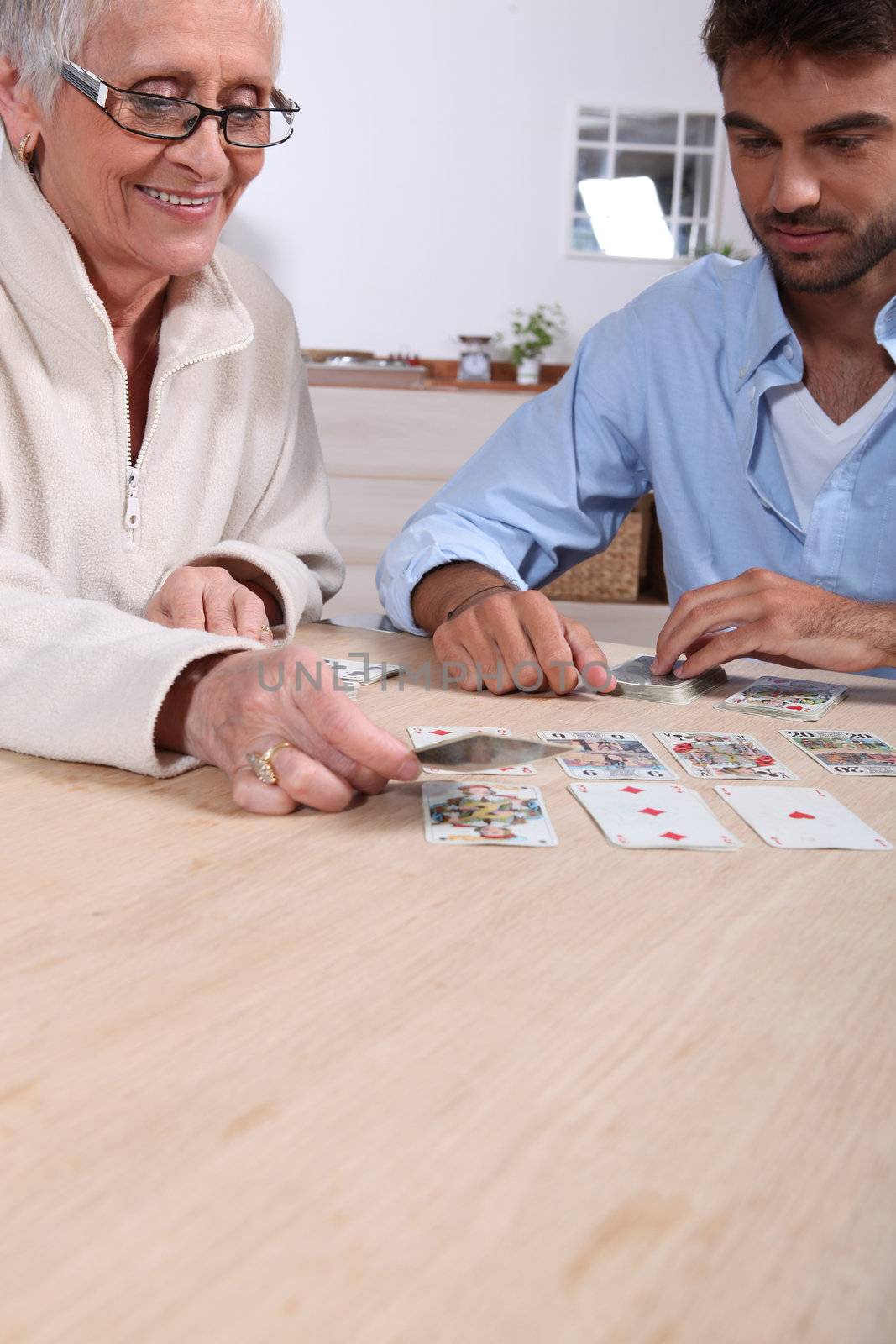 Mother and son playing cards