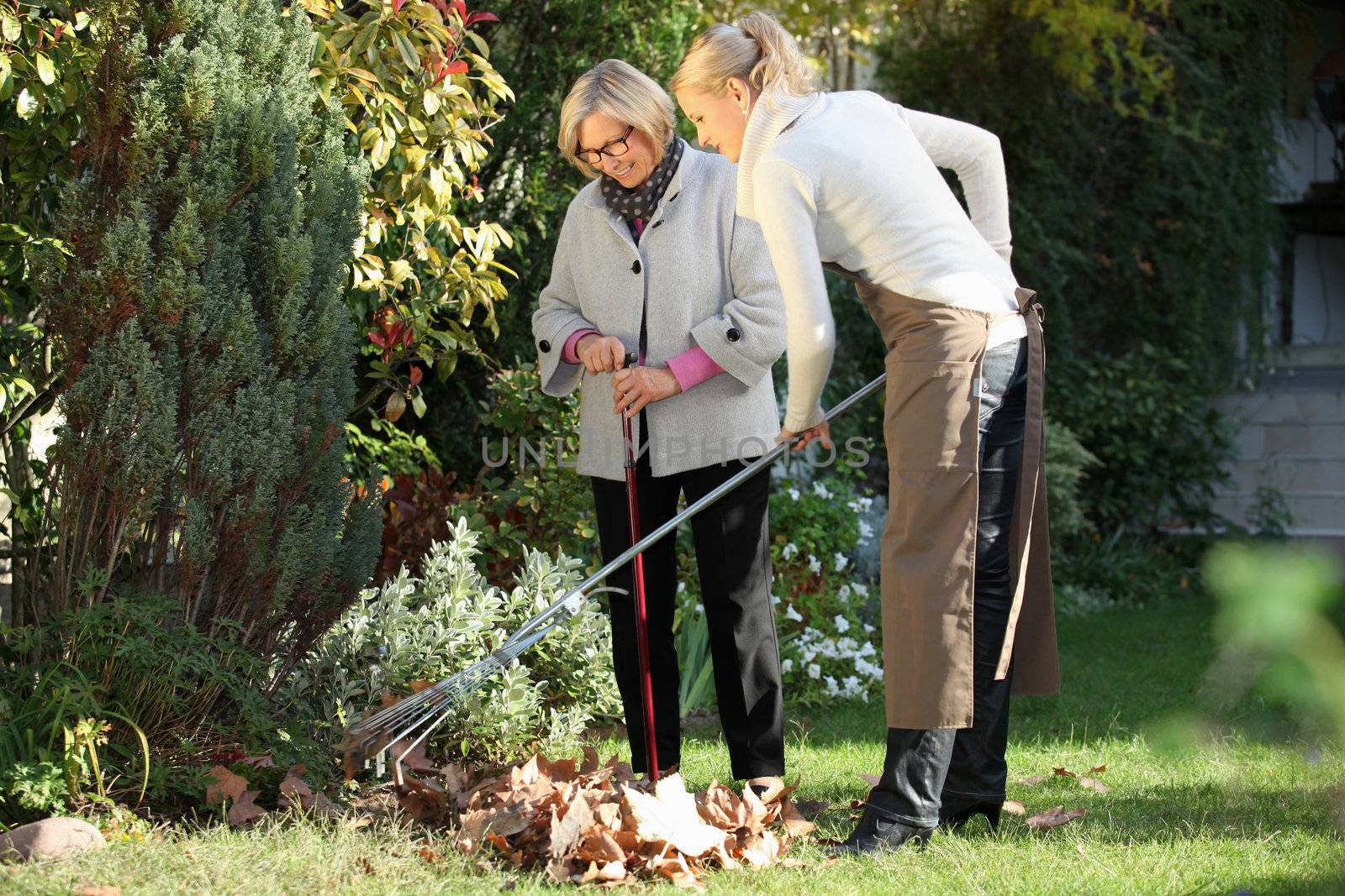 Elderly woman with her gardener by phovoir
