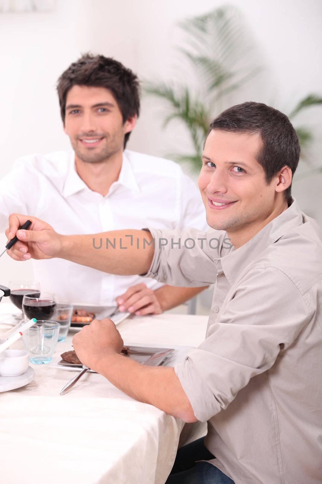 two young men having lunch