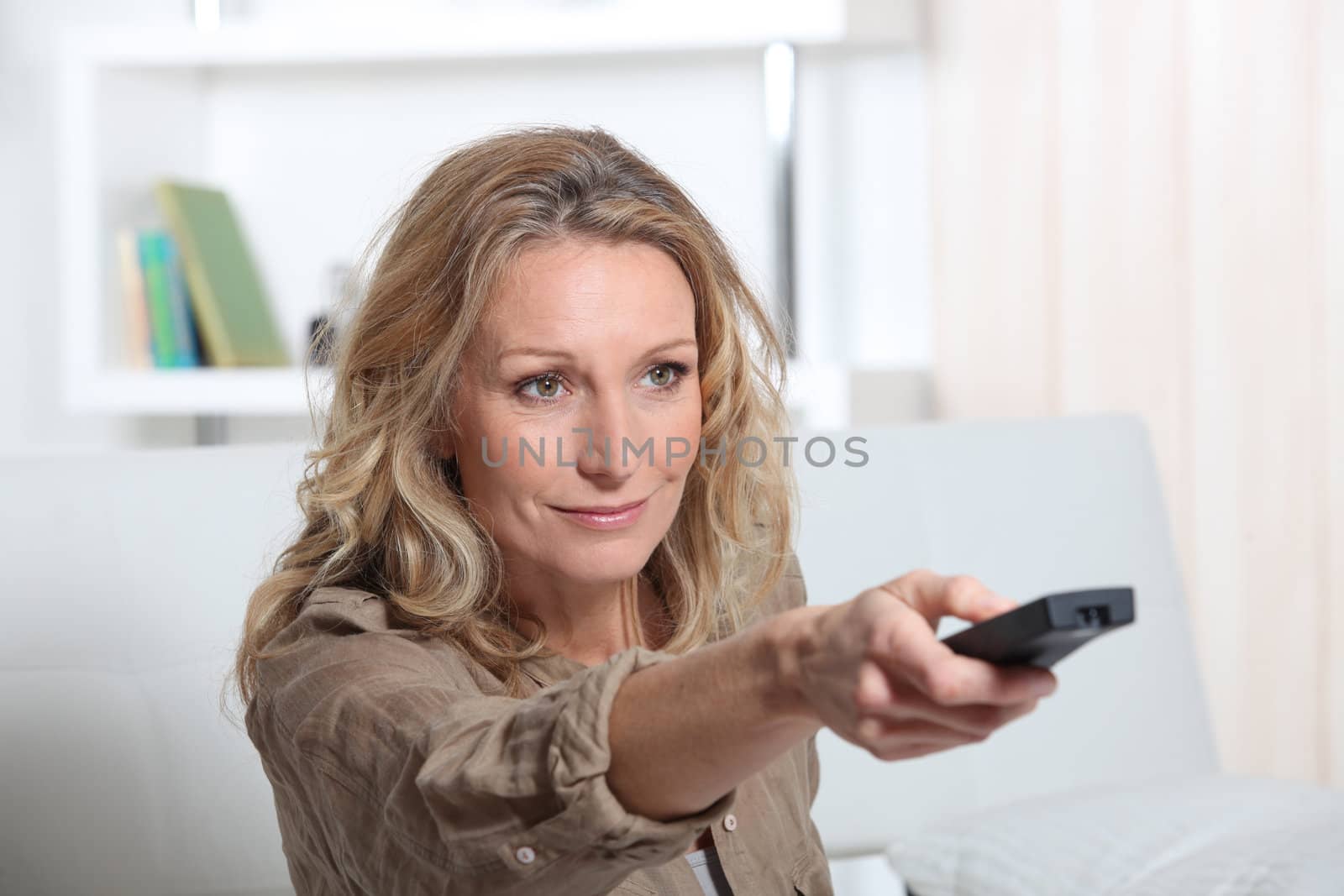 portrait of a woman with remote control
