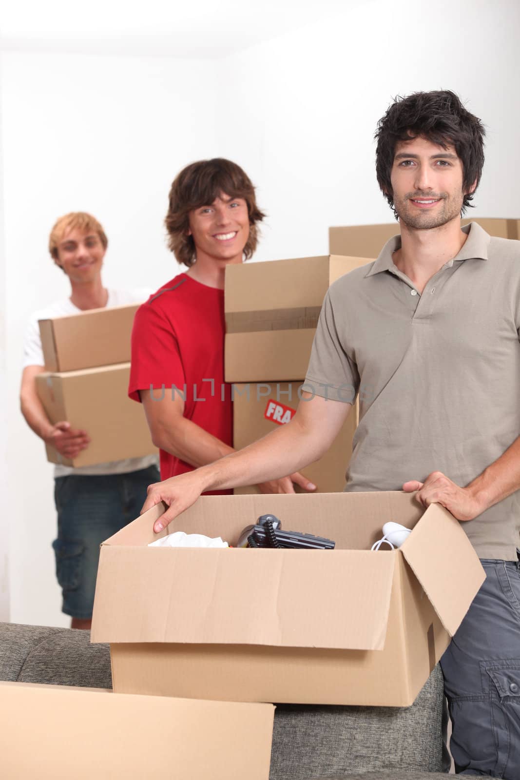 Young men moving boxes