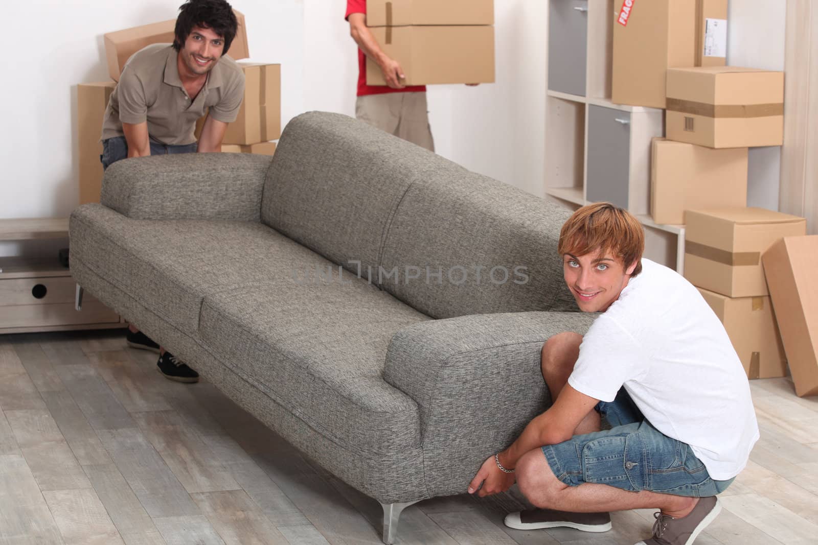 Men lifting sofa