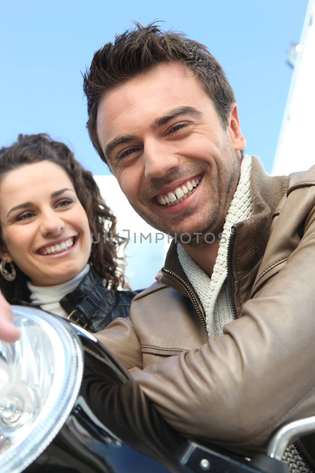 Man and woman on motorbike