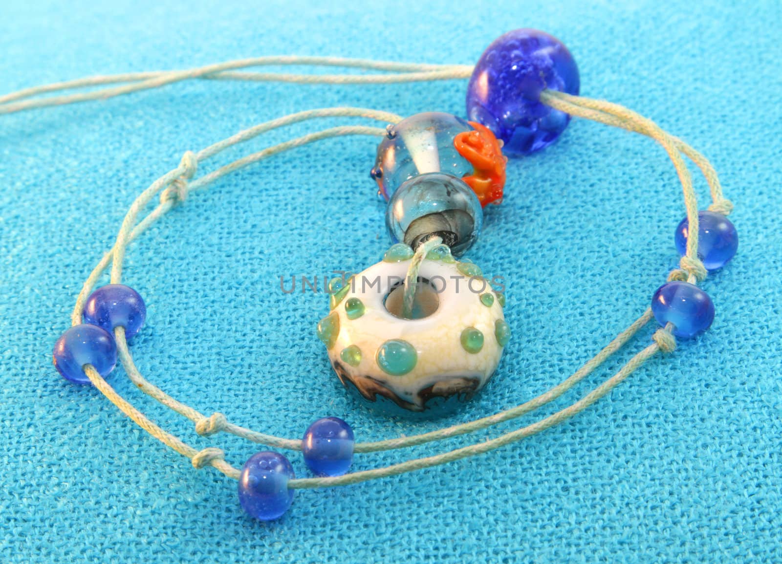 Blue beaded pendant by Yarvet