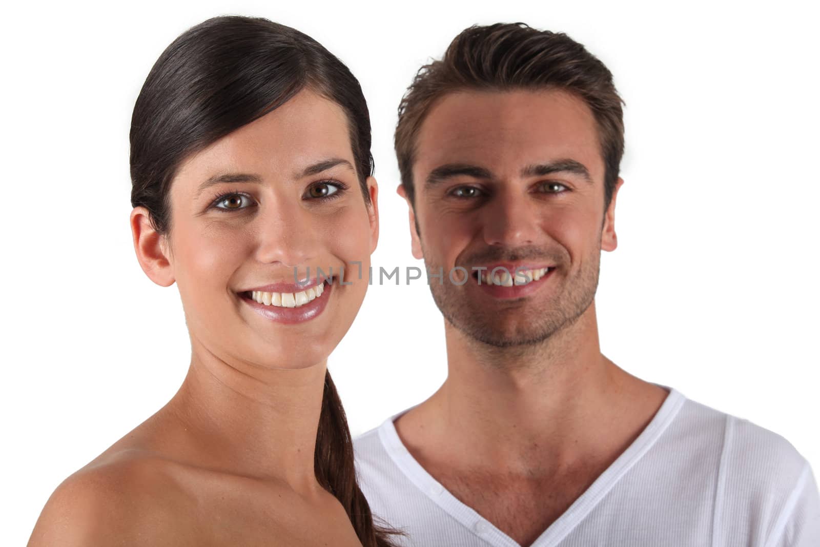 Attractive couple stood in studio by phovoir