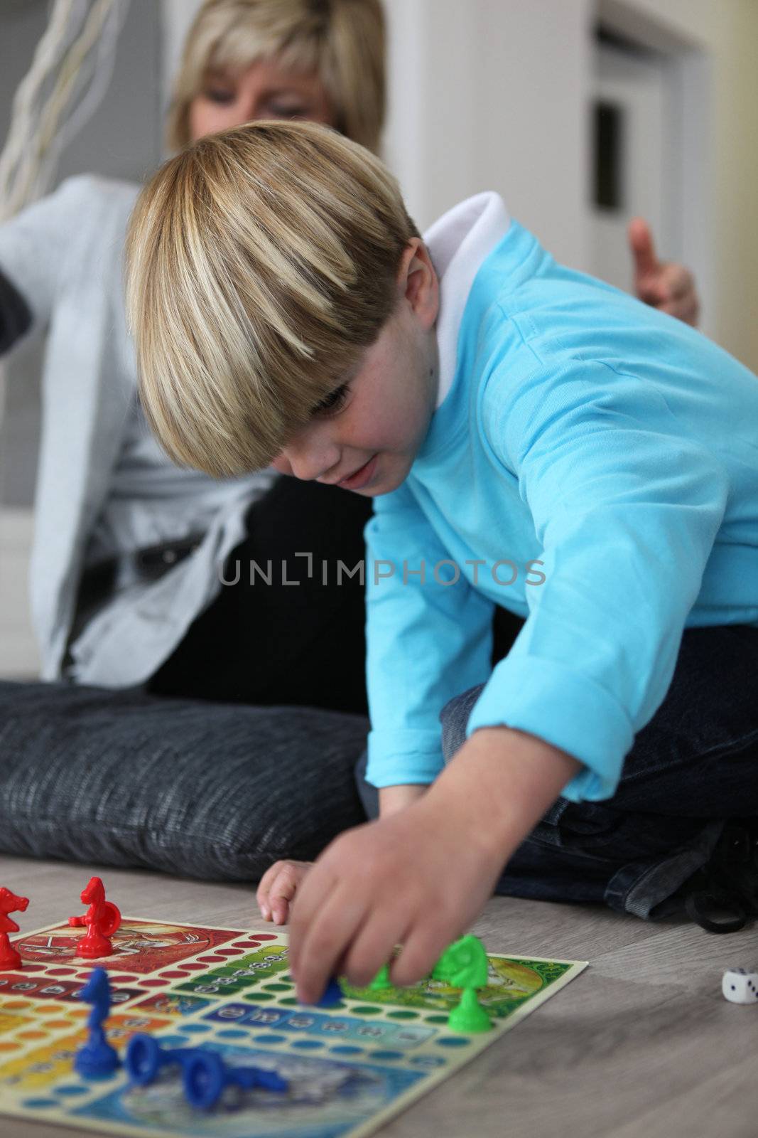 Little boy playing a board game