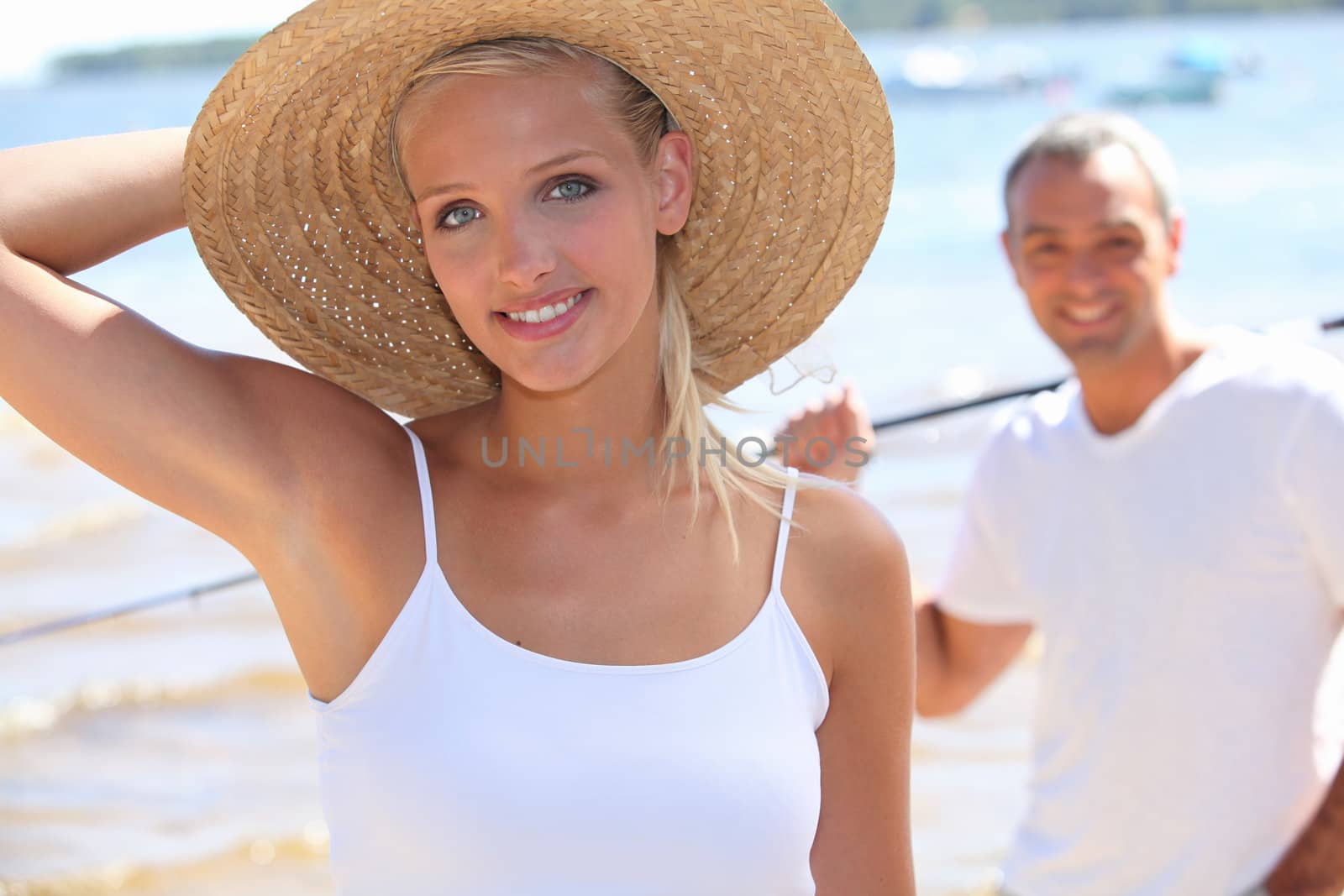 Couple at a lake in summer by phovoir