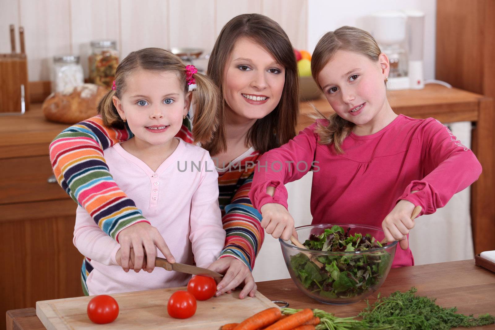 mother and daughters cooking together