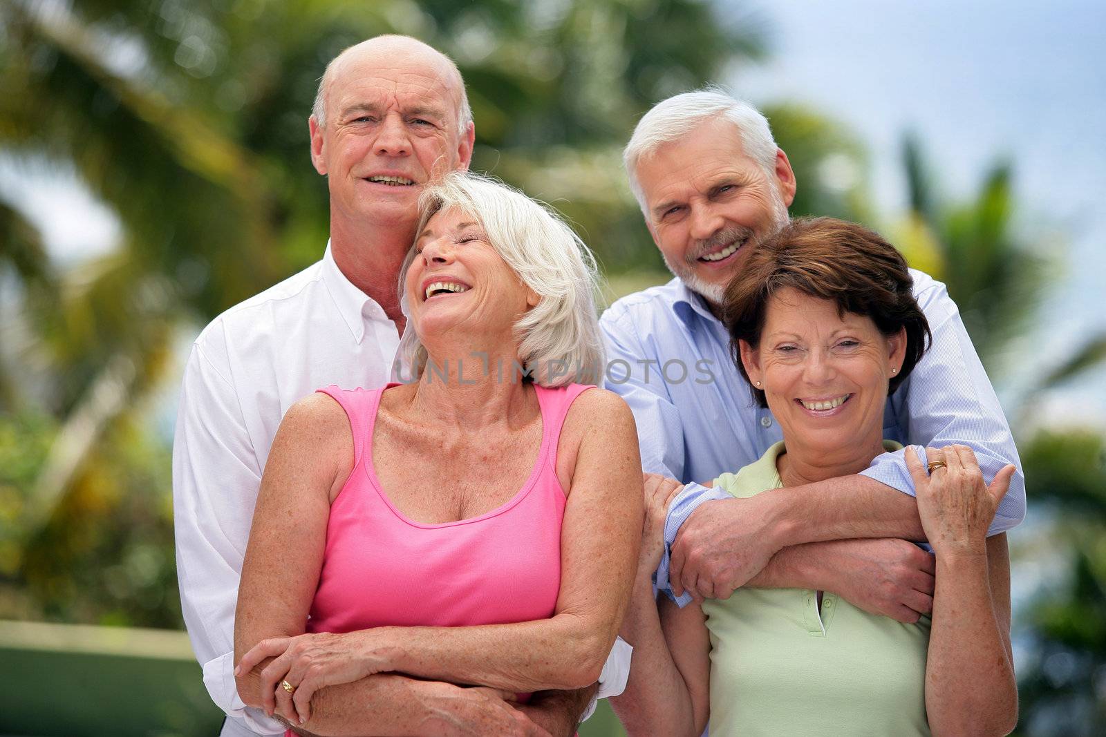 Two senior couples in the garden