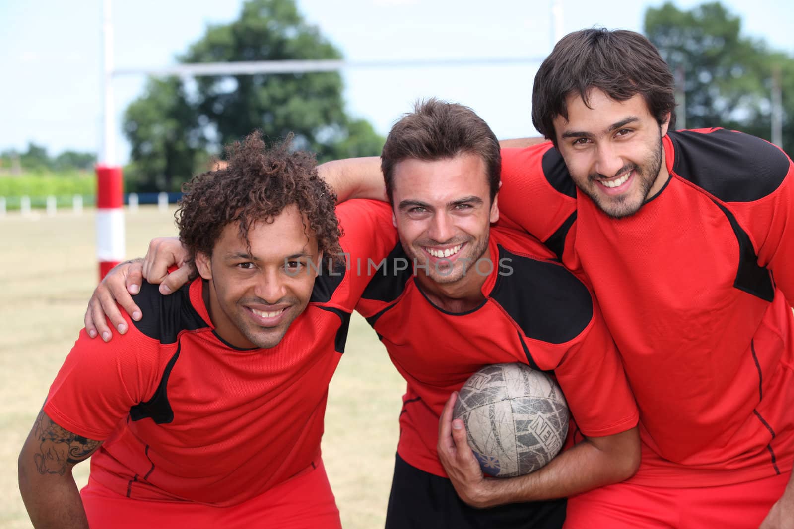 Three football team mates