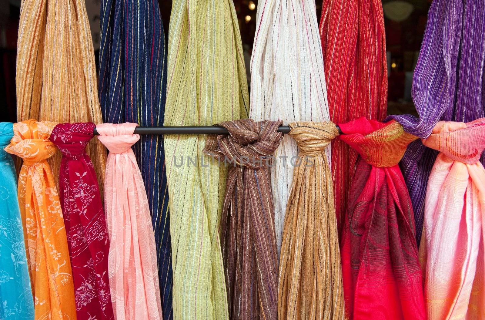 bolts of fabic or scarves hanging for sale