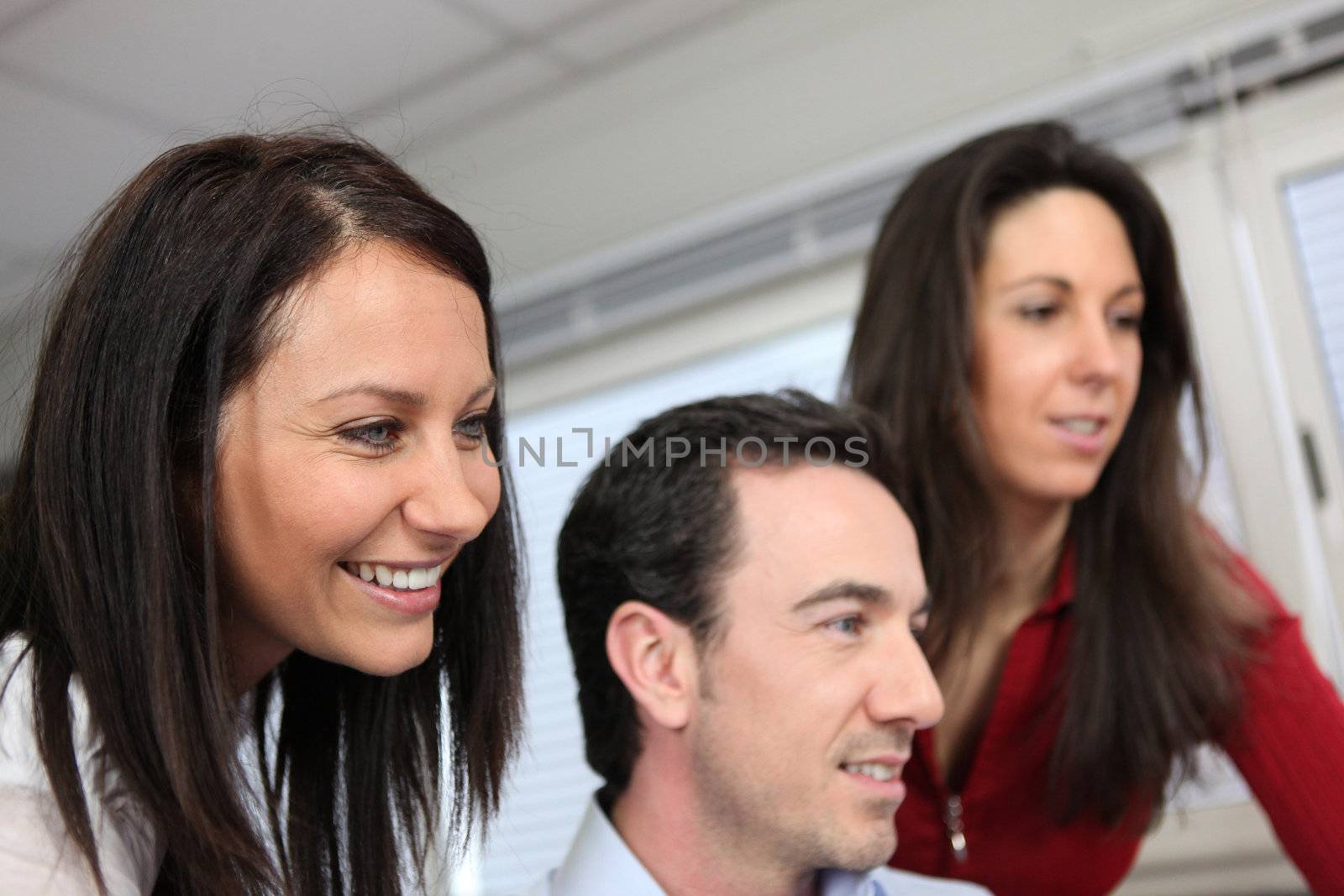 Headshot of three colleagues at work