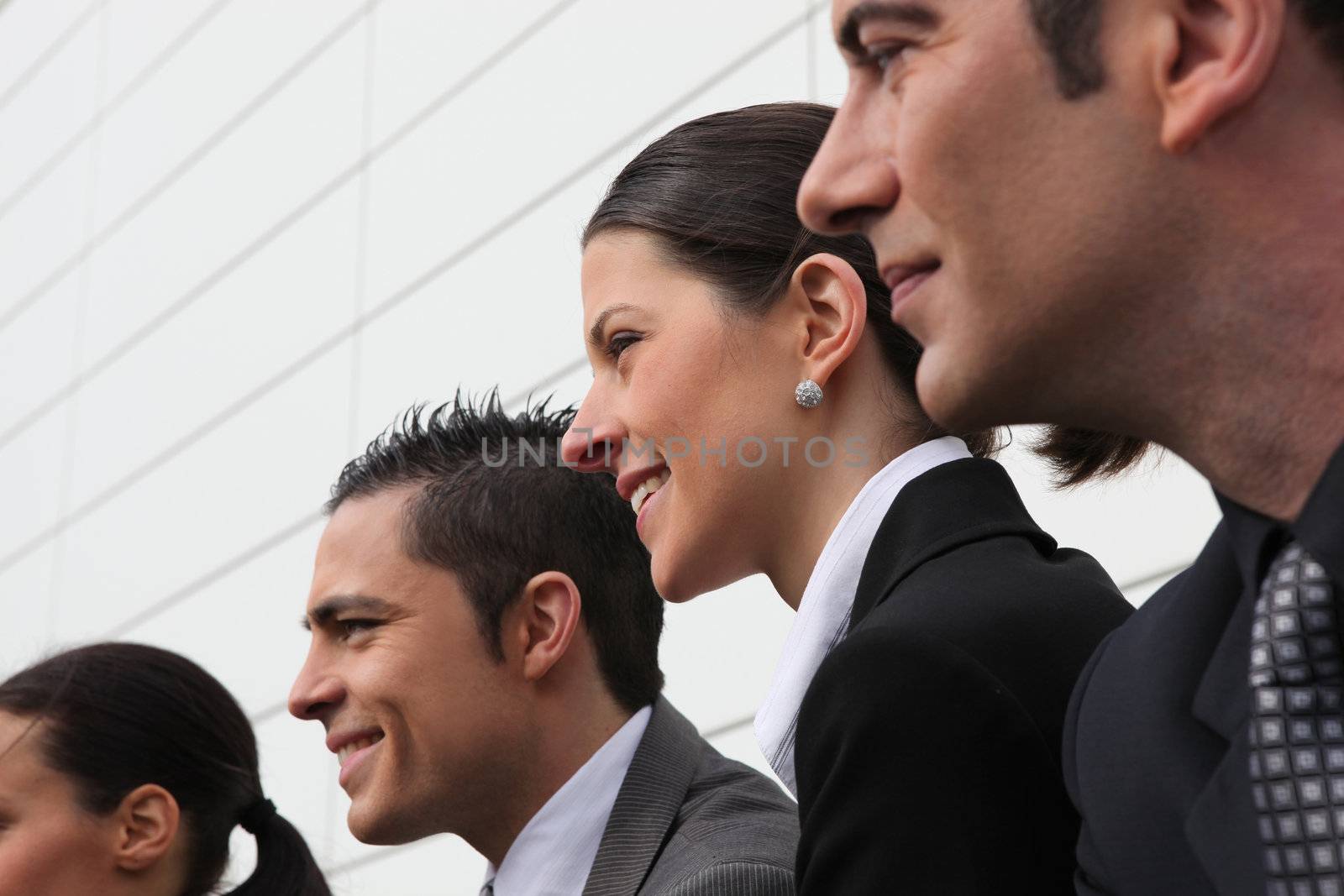 Line of smiling executives