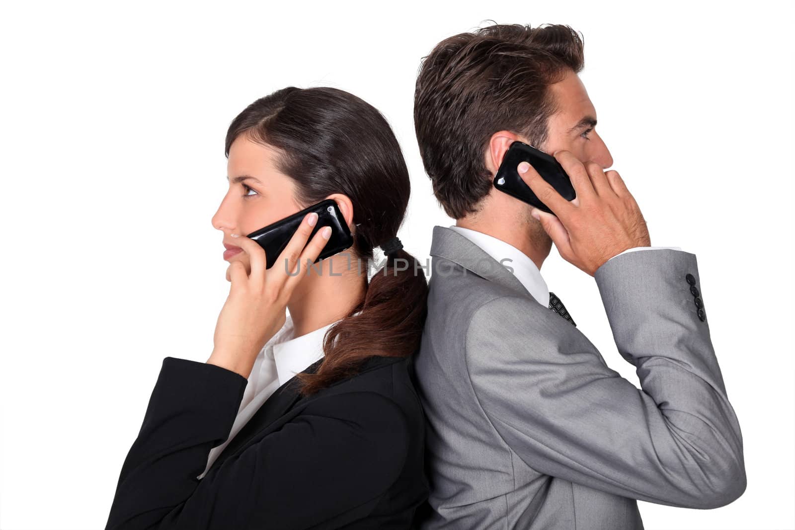 businessman and businesswoman telephoning by phovoir