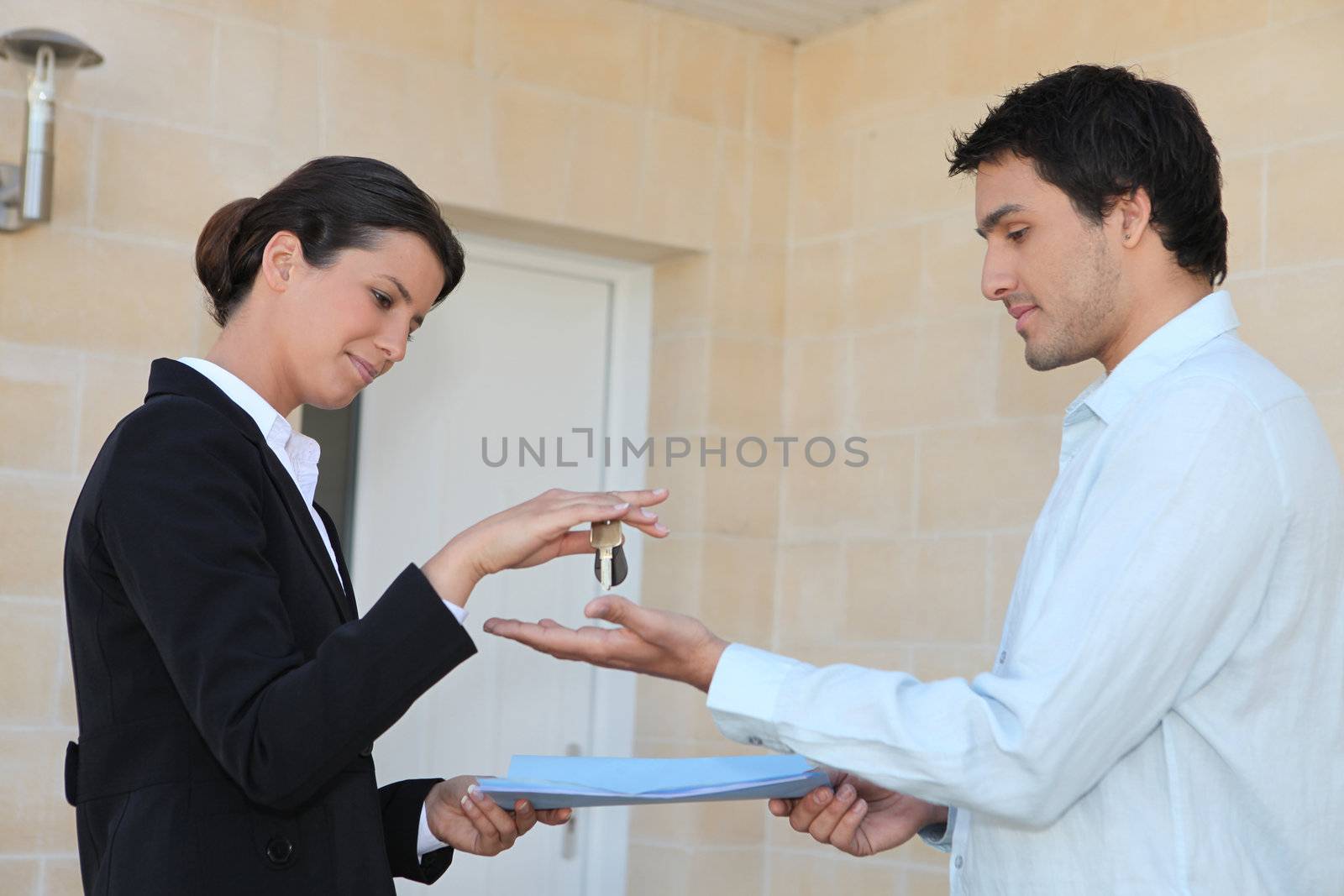 New property owner receiving the keys to his property by phovoir
