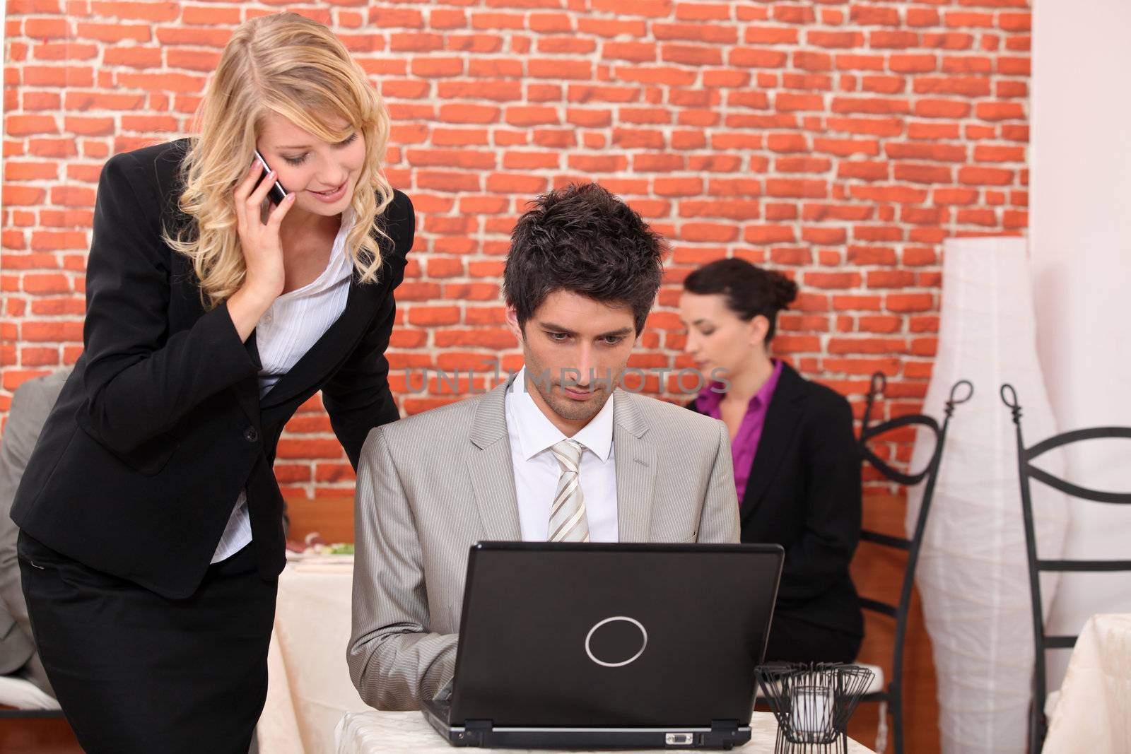 Man and woman looking at a laptop computer