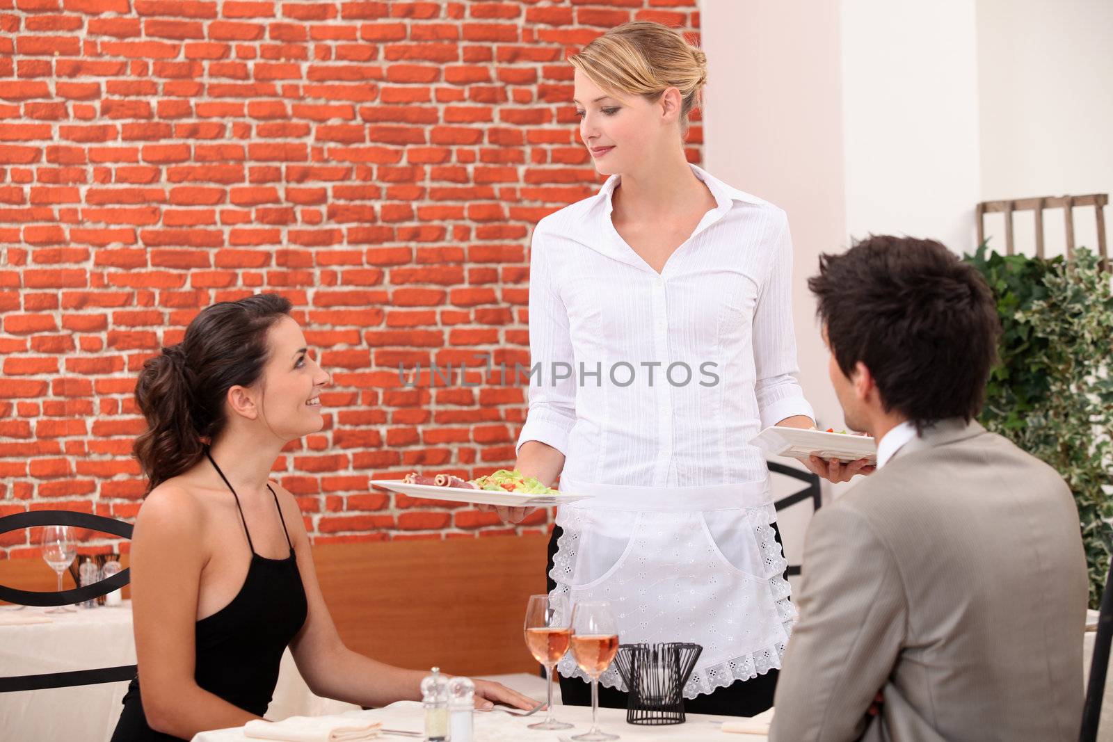 Young couple in classy restaurant