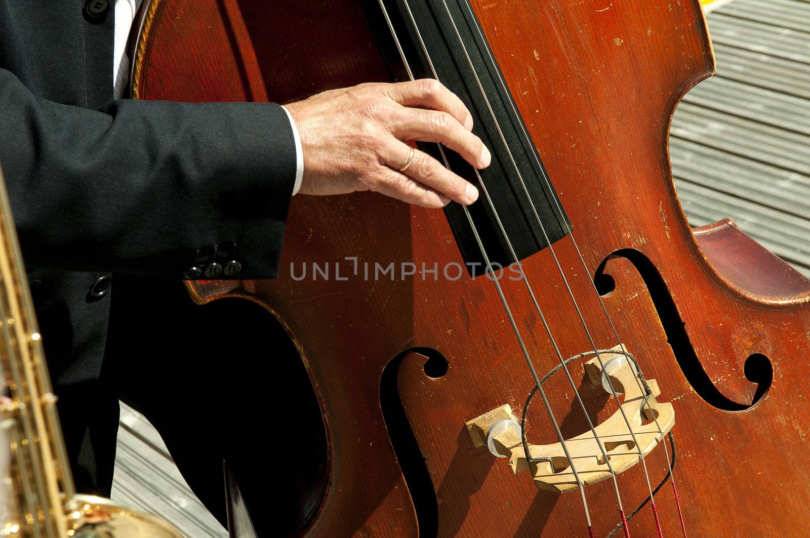 musicians playing instruments in the sun by jackmalipan