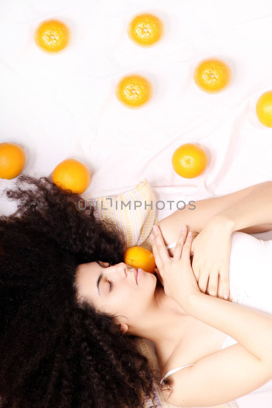 A young south american woman dreaming of fruits.