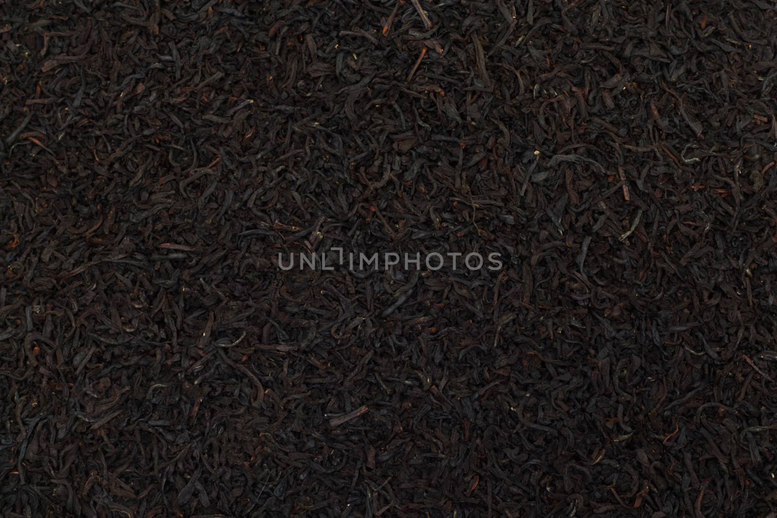 Black tea leaves background. Abstract food textures.  by schankz